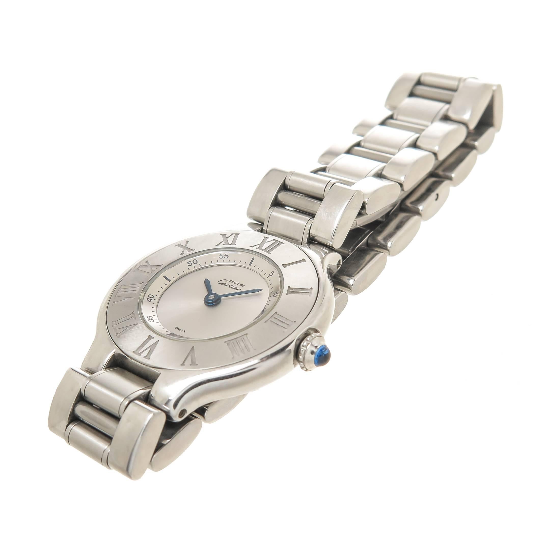 Circa 2000 Cartier Must 21 Ladies Wrist watch, 28 M.M. Stainless Steel Water Resistant case, Quartz Movement, Silver Dial, Roman Numeral Bezel, Sapphire Crown. 1/2 inch wide Stainless Steel bracelet with fold over Deployment clasp. Watch length 6