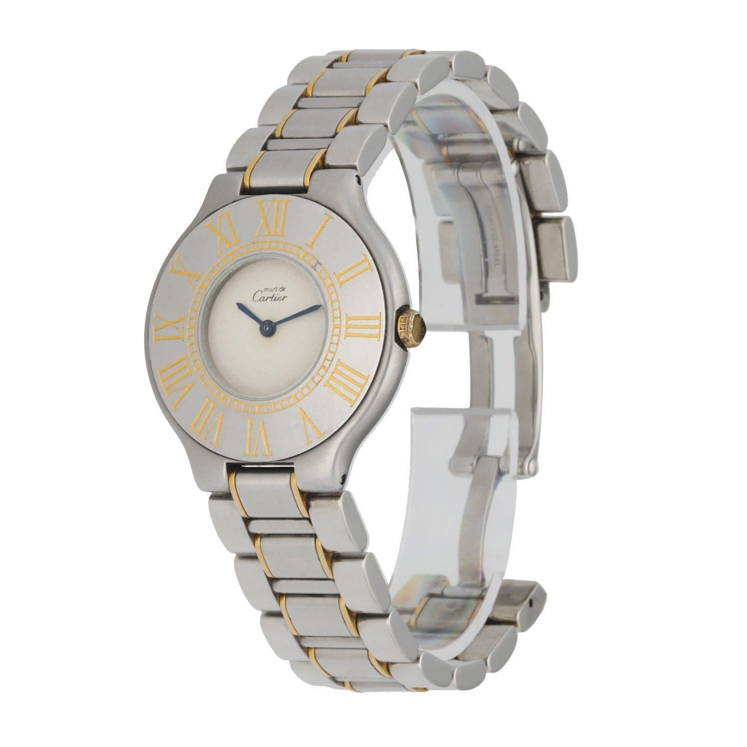 Cartier Must de 21 Ladies Watch. 30mm Stainless Steel case. Stainless Steel Stationary bezel with golden tone Roman numeral hour marker engraved. Minute markers engraved on the inner bezel. Silver dial with blue steel hands. Two tone, stainless