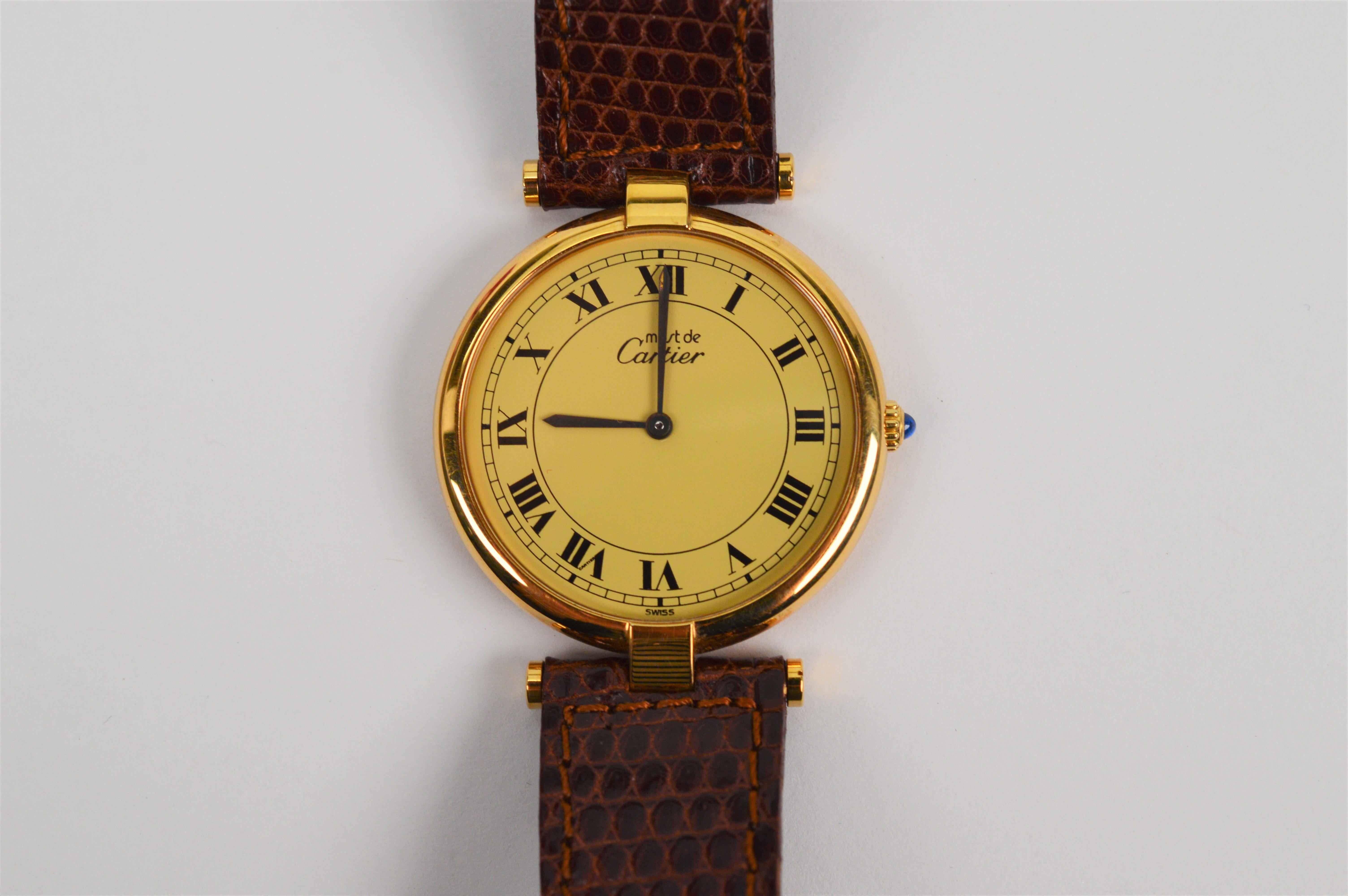 Own this Cartier Must de Cartier Vendome .925 Argent 18K Gold Vermeil Case 24mm Champagne Dial Quartz Watch
Number 060538. Circa 1990, this watch is a battery-powered Swiss made quartz movement. The 30mm case is sterling silver .925 gold plated in