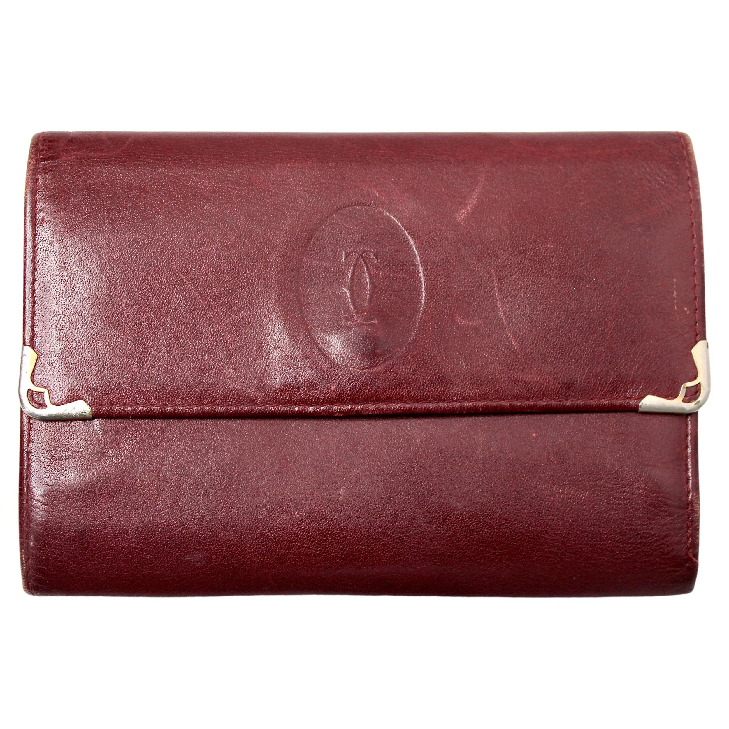 Portafoglio Trifold in pelle bordeaux Must de Cartier circa anni '80 in vendita