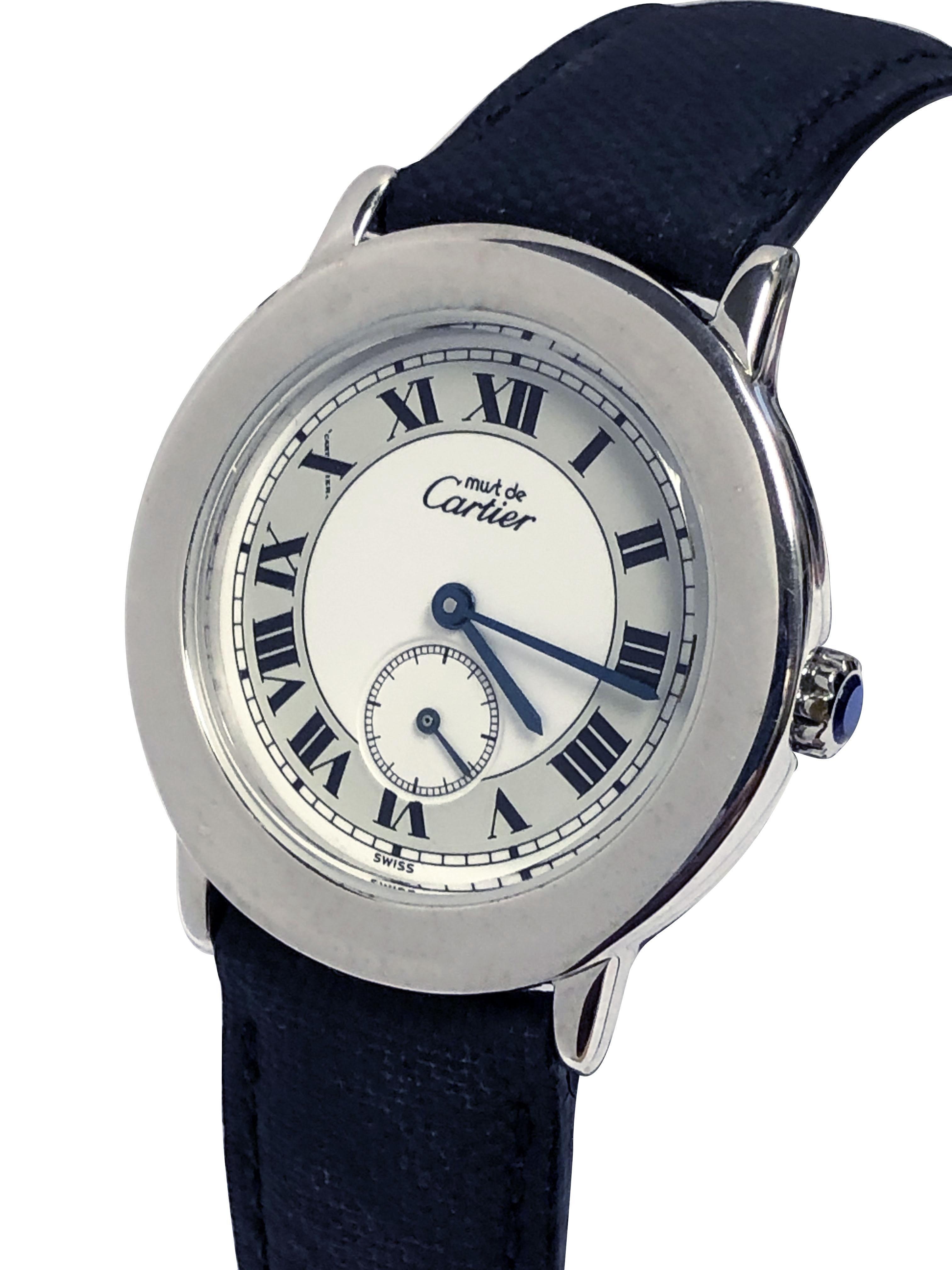 Crirca 1990s Cartier, Must de Cartier Wrist Watch, 32 M.M. Sterling Silver 2 piece Water resistant case, Quartz movement, White two tone dial with Black Roman numerals and a sub seconds chapter. Sapphire set Crown. Original Black Fabric Strap with