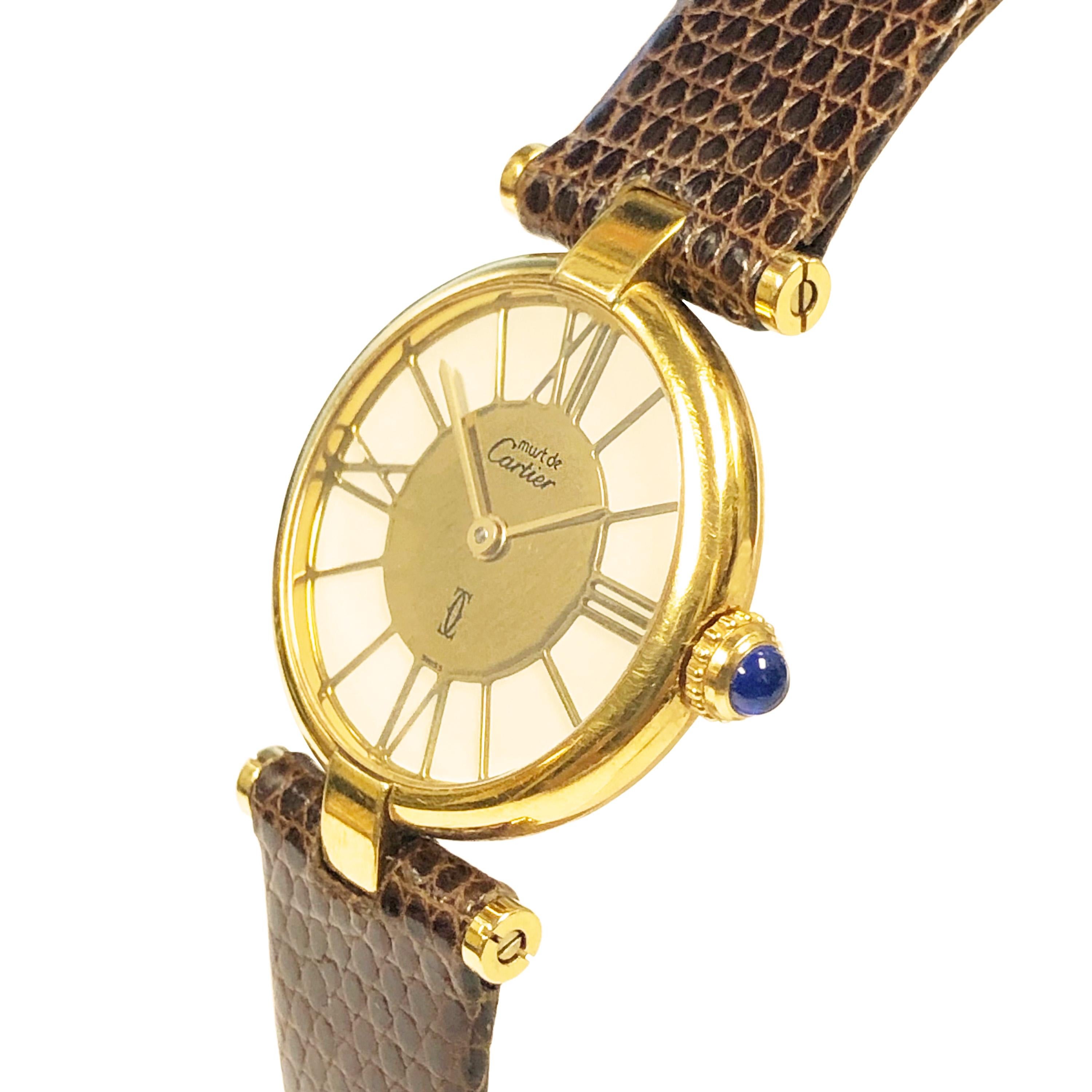 Circa 2000 Cartier ladies Must De Cartier Vendome Wrist watch, 24 MM Vermeil  ( Gold Plate on Sterling Silver ) case. Quartz Movement, White Dial with Gold Roman Numerals and a Sapphire crown. New Brown Lizard Strap with Gold Plated Cartier Tang