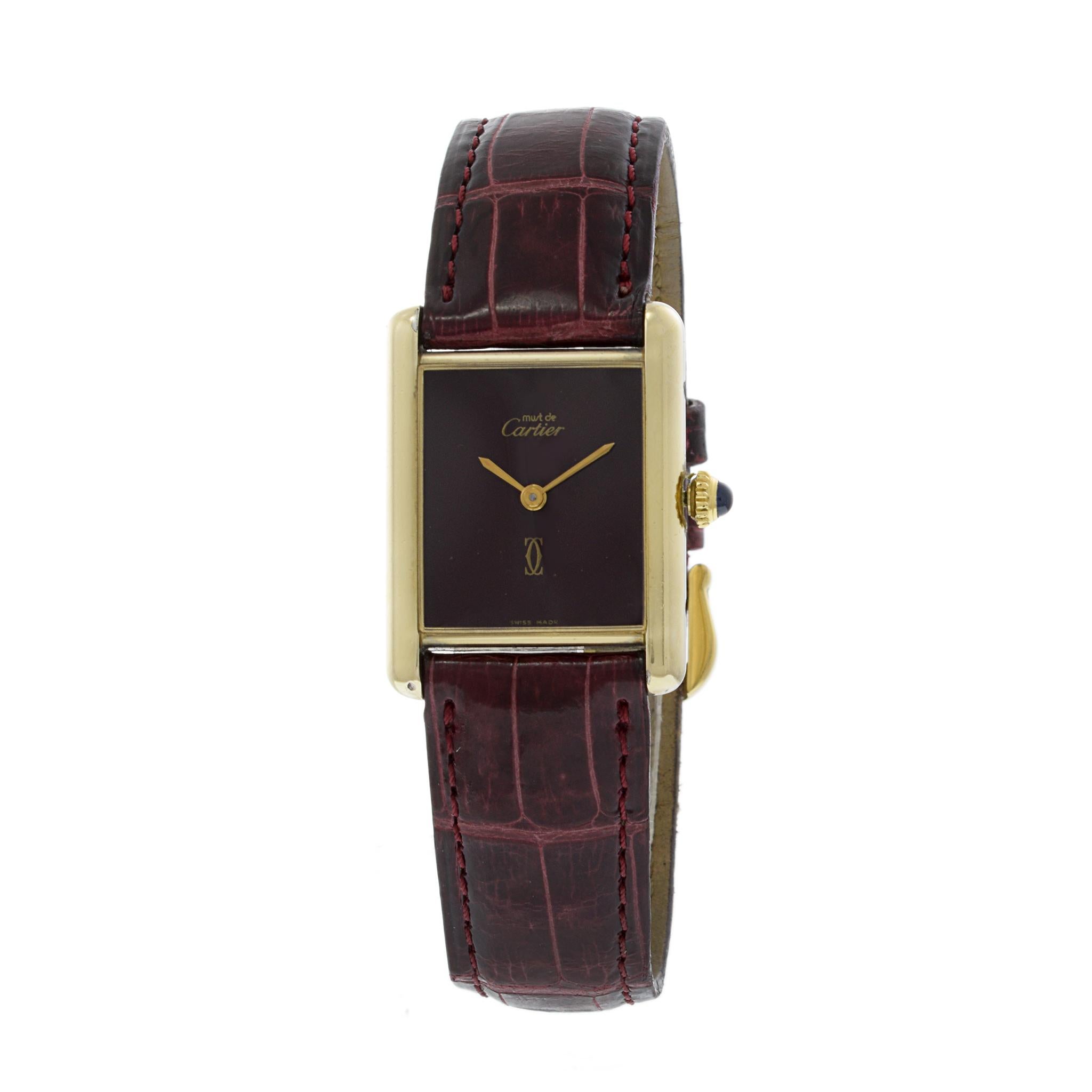Introducing the Cartier Tank Vermeil Watch: Timeless Elegance.

Embrace refined luxury with the Cartier Tank Vermeil Watch. This iconic timepiece from the 1970s boasts a bordeaux dial, radiating timeless sophistication. The 23.5mm x 30.5mm