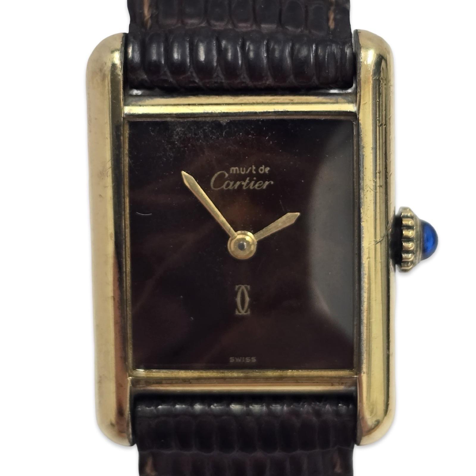 A refined Cartier Must de Tank Vermeil wristwatch with a 20mm case, crafted in sterling silver (925 Argent) and finished in 20-micron gold plating. This Paris-signed Tank showcases a rare chocolate lacquer dial, accented by gold-tone hands and the