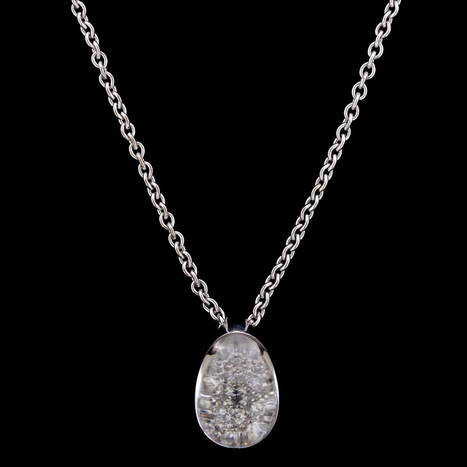 Cartier Myst De Cartier 18K White Gold Rock Crystal Diamond Pendant. The pendant is set with full cut diamonds, approx. total wt. .50cts., beneath a cabochon rock crystal, #939118, length 16