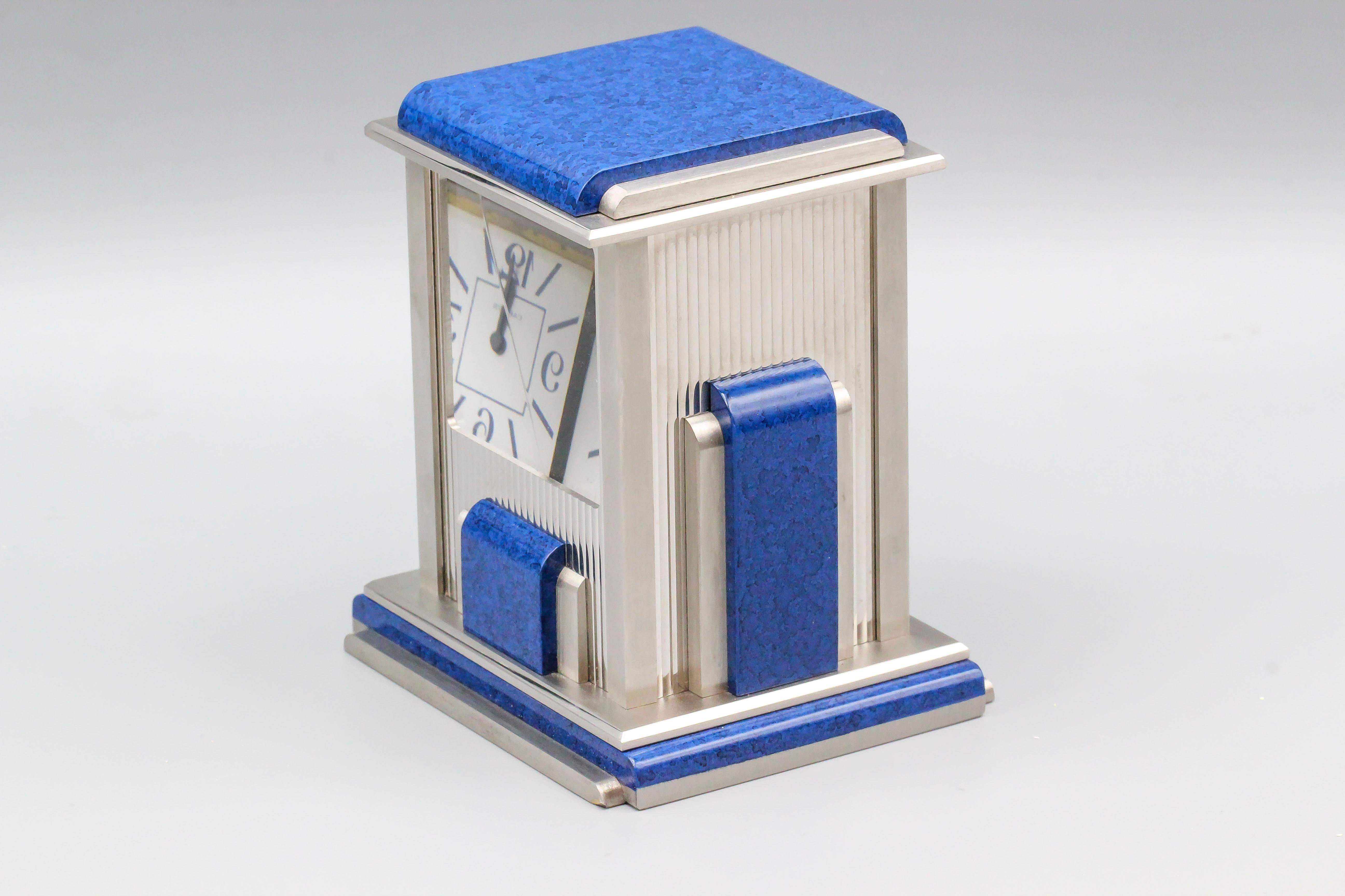 Fine estate clock, known as the Prism model, by Cartier circa 1990s. Working by showing a set of mirrors creating an illusion that the box is empty unless you look at a certain angle and you can see the face. Quartz movement with Roman numeral