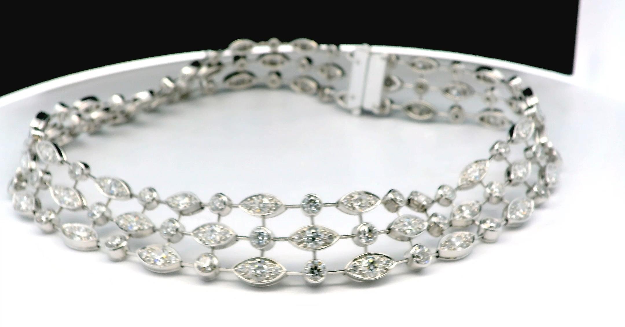 This exquisite choker necklace is expertly crafted from 18k gold. The design features a series of both marquise and round settings, each holding a sparkling diamond, with a total weight of approximately 20.3 carats.

The intricate structure consists