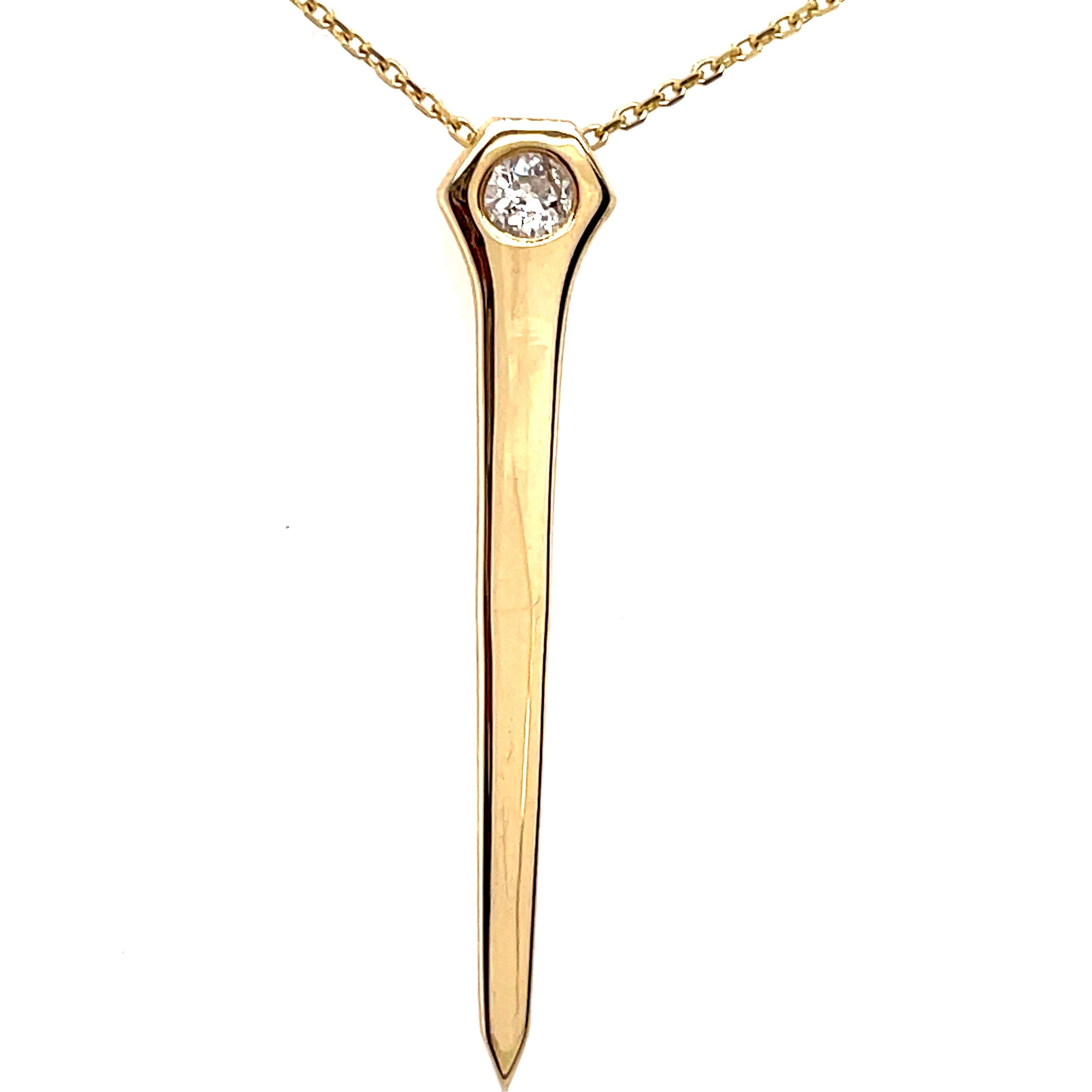 Intriguing charm/pendant:  a figural nail.  Made, signed and numbered by CARTIER NEW YORK.  Set with a faceted old-European diamond, approximately .50 carats.  There are two hidden loops on the back for a chain.  1 3/4