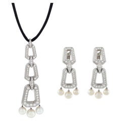 Set di collana e orecchini Cartier in oro bianco con diamanti e perle
