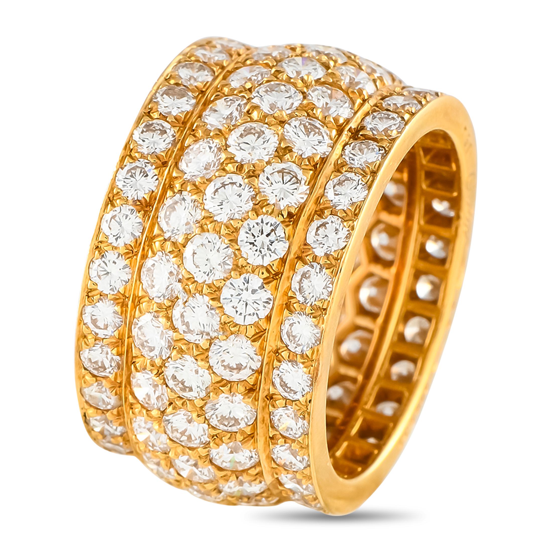 Covered in sparkling Diamonds with a total weight of 5.65 carats, this dazzling Cartier Nigeria ring will continually impress. The simple, understated 18K Yellow Gold setting provides the perfect backdrop for the dazzling array of gemstones. This