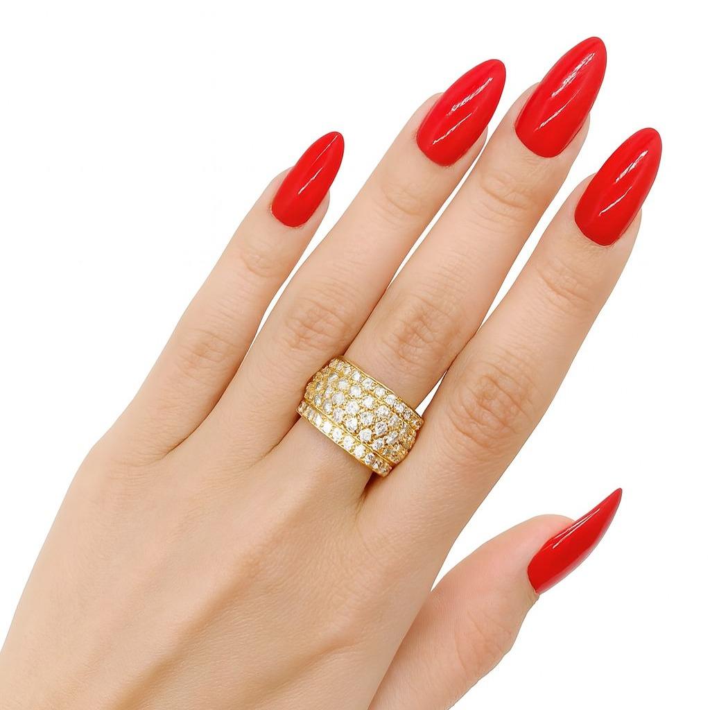 Cartier Nigeria 18K Yellow Gold Diamond Wide Band Ring

This authentic Cartier Nigeria collection ring is crafted in 18K yellow gold and set with a stunning array of round brilliant cut diamonds. The design is bold yet sophisticated, showcasing