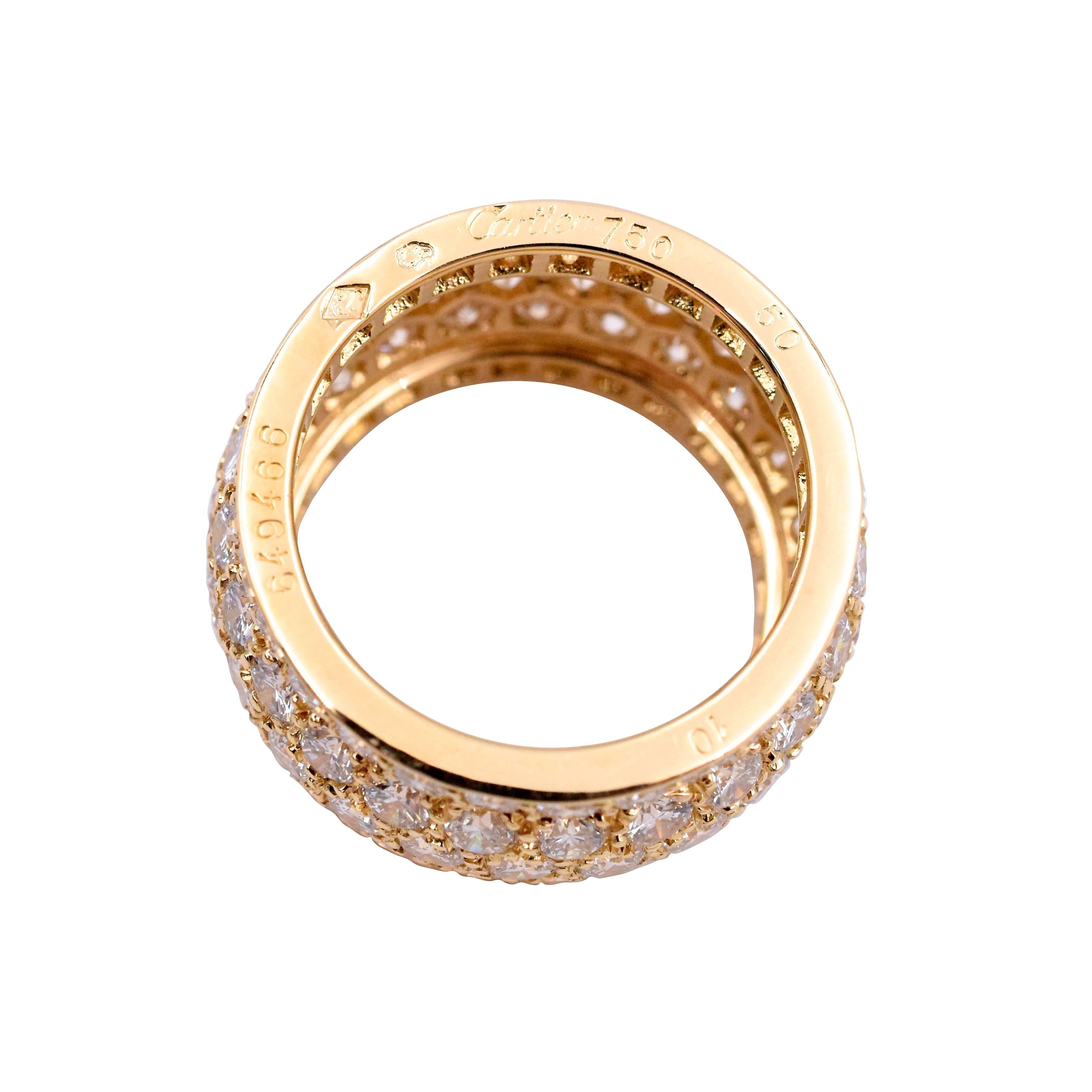 A gold and diamond eternity ring by Cartier, from the 
