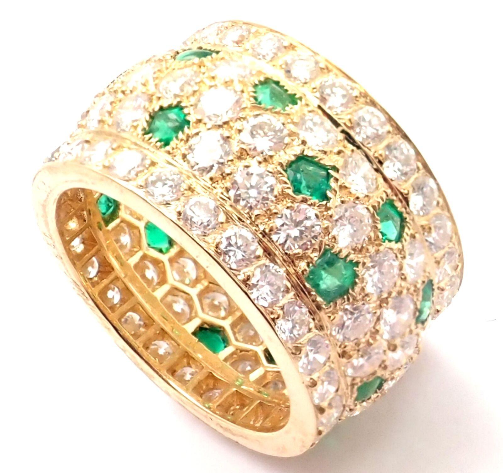18k Yellow Gold Nigeria Diamond Emerald Wide Band Ring by Cartier.
With Round brilliant cut diamonds VVS1 clarity, F-H color And Buff Top emeralds total weight approximately 5.50ct
Details:
Ring Size: European 52, US 6
Band Width: 13mm
Weight: 9.8