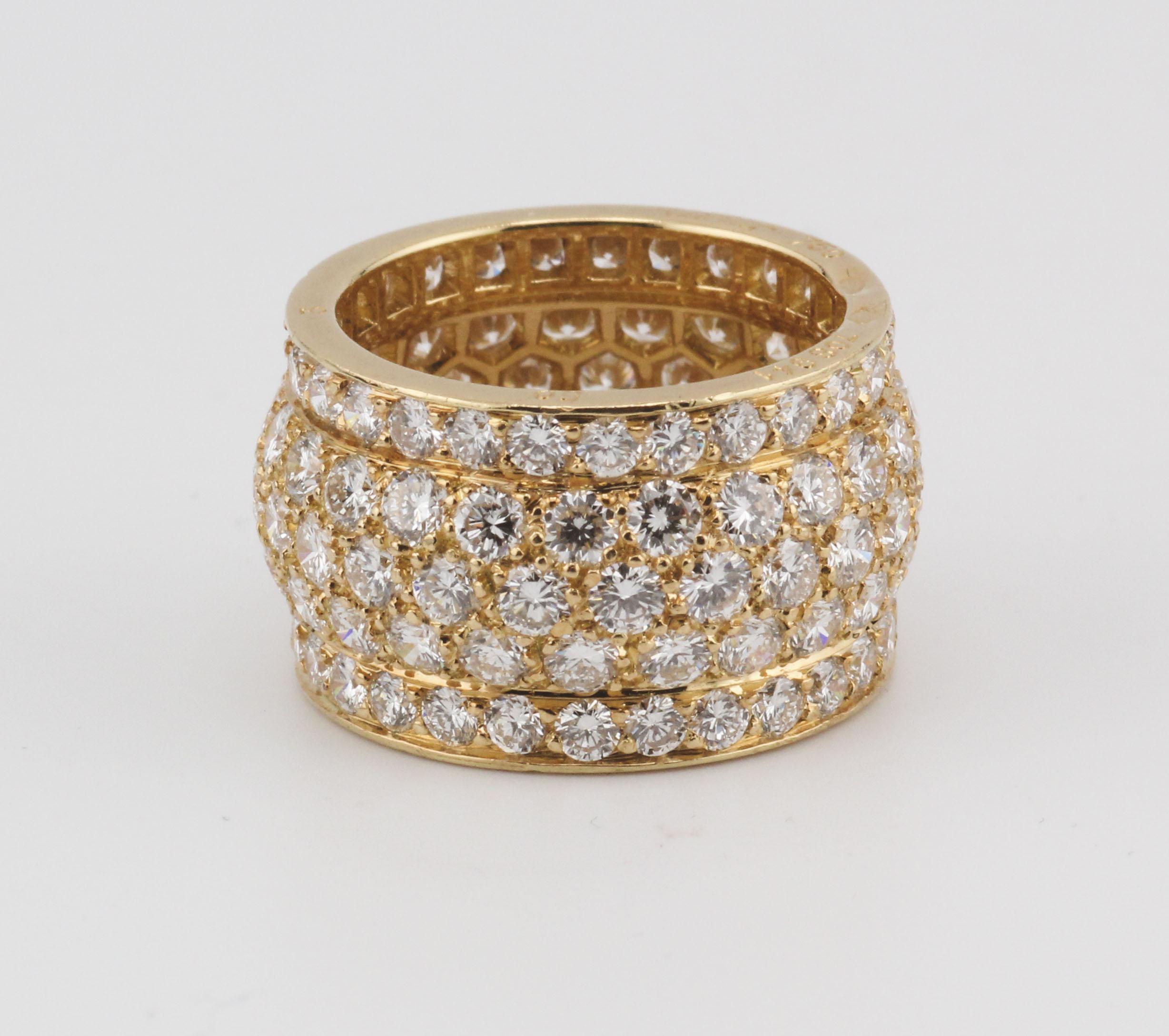 Indulge in the epitome of opulence with this fine Cartier 5-row diamond 18 Karat yellow gold band. This exquisite piece is a tribute to Cartier's commitment to craftsmanship, luxury, and cultural influence.

Crafted in the finest 18 karat yellow
