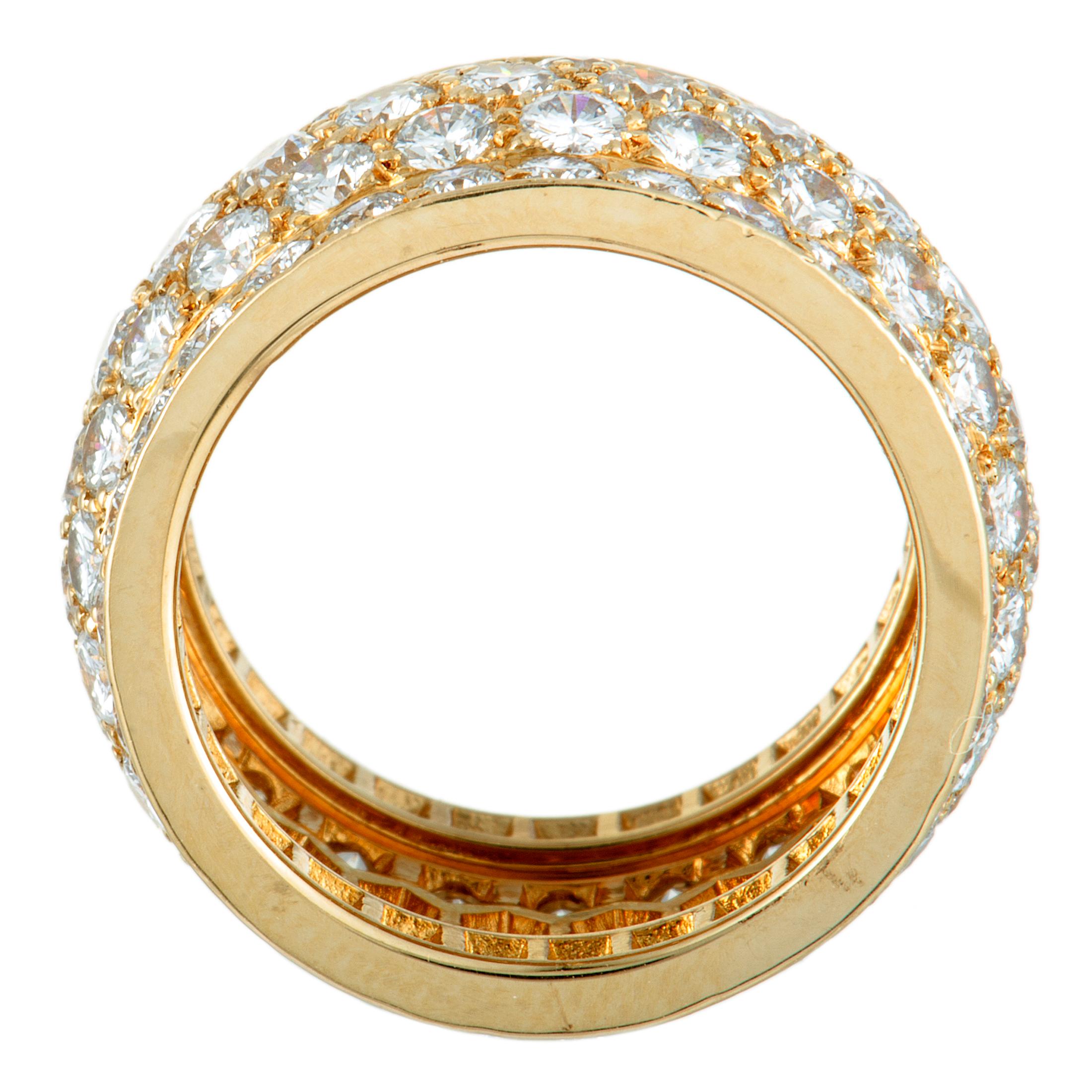 Created for the exquisite “Nigeria” collection, this extravagant Cartier ring is presented in luxurious 18K yellow gold and lavishly decorated with a plethora of resplendent diamonds. The diamonds boast grade F color and VVS clarity and amount to