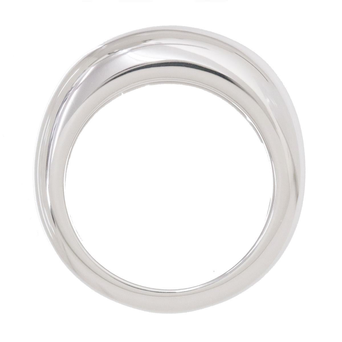 Featuring a wide silhouette, this Cartier Nouvelle Vague ring is designed in an 18k white gold. It features a slightly raised pattern with a striking 
high-polish finish. Comes with original Cartier box.  Ring is hallmarked 