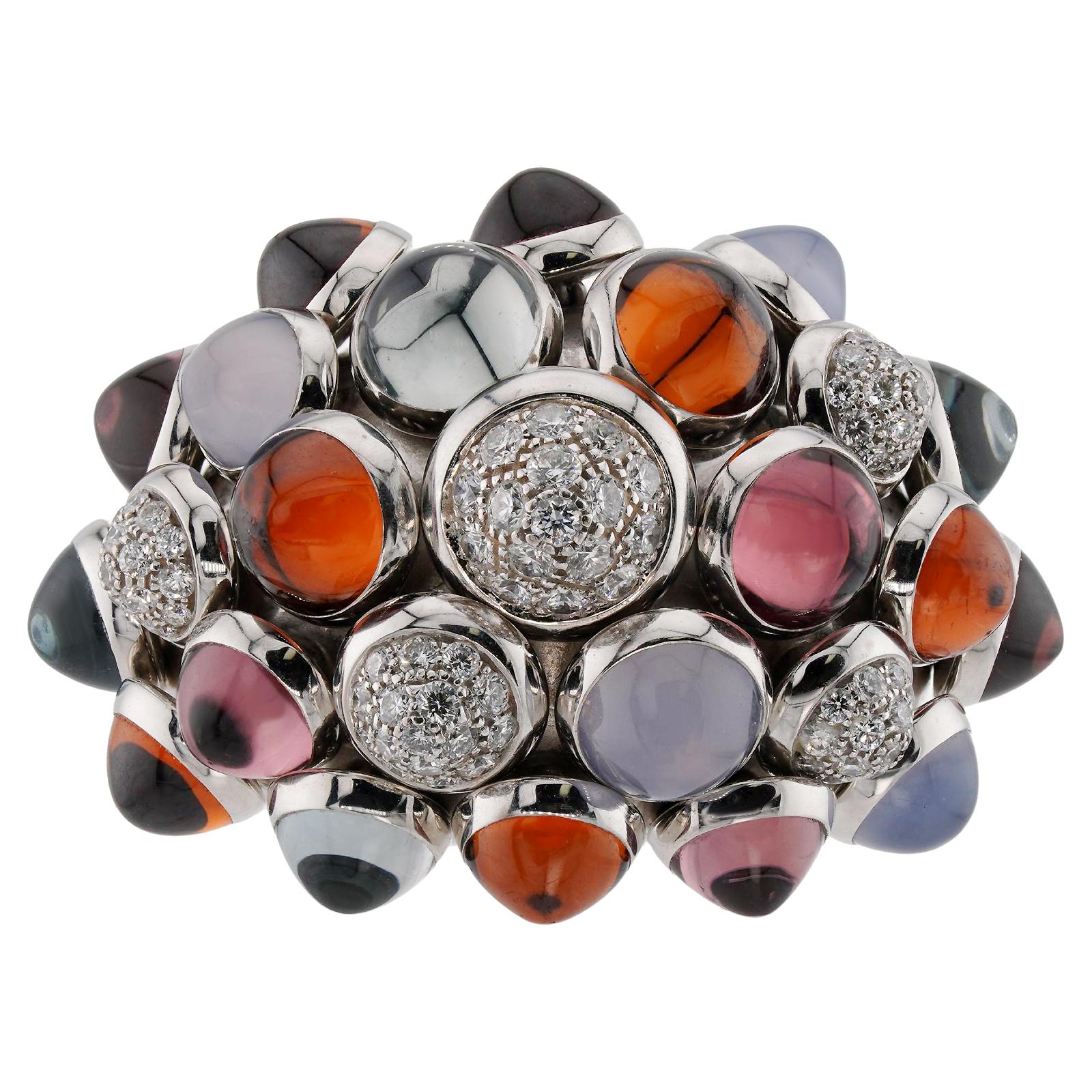 This exquisite ring from Cartier's luxury Nouvelle Vague collection is crafted in 18k white gold and set with cabochon moonstones, pink tourmalines, citrines and aquamarines, and about 80 brilliant-cut round diamonds weighing an estimated of 1.00 to