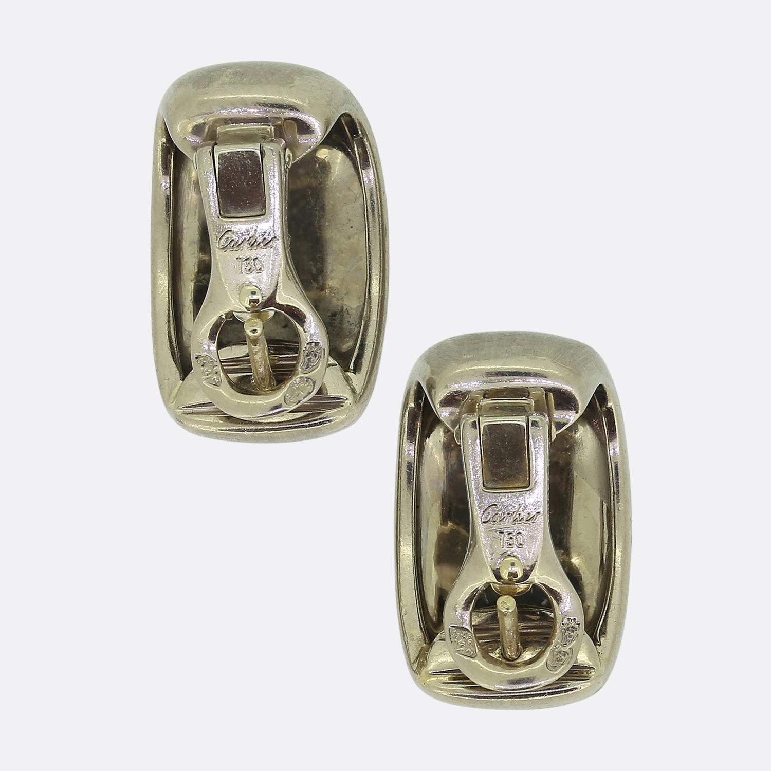 Here we have an excellently crafted pair of 18ct white gold earrings from the world renowned jewellery house of Cartier. Each piece takes on a half hooped domed form and has a matte finish.

Condition: Used (Good)
Weight: 11.3 grams
Dimensions: