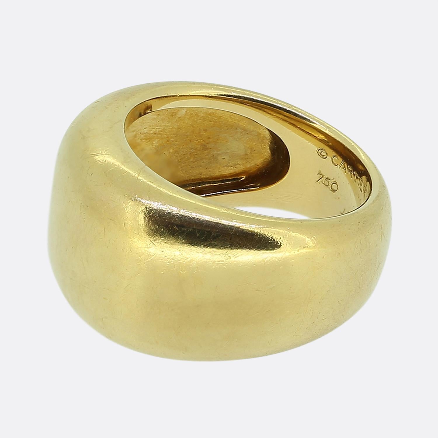 Here we have a classically styled 18ct yellow gold piece from the world renowned luxury jewellery house of Cartier. This ring forms part of the 'Nouvelle Vague' collection and presents a smooth domed shaped structure whilst weighing an impressive