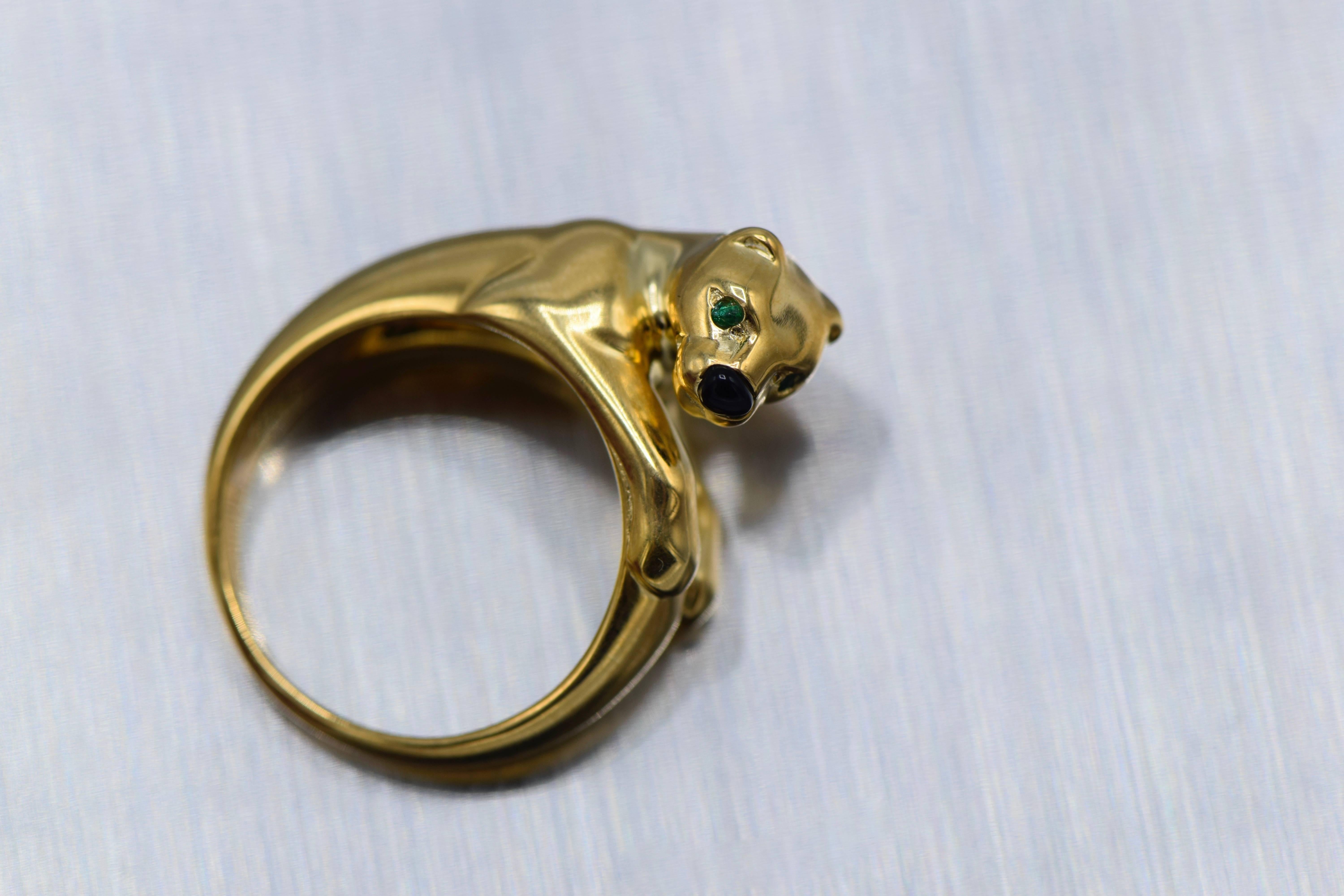 Cartier, Onyx, Emerald Ice Panther 18 Karat Gold Ring

Size 6.5 