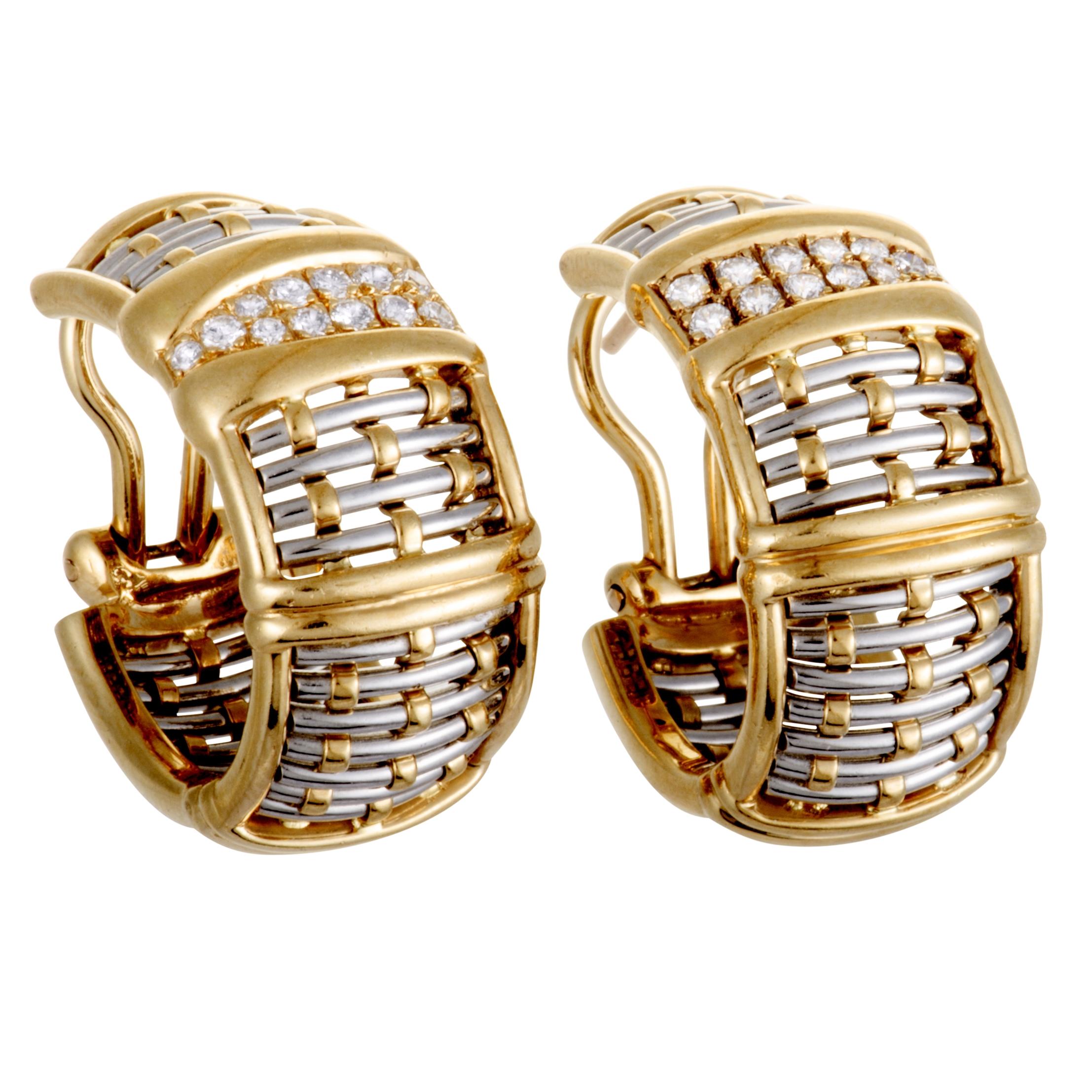 An incredibly fashionable design is beautifully presented in 18K yellow and 18K white gold in these extraordinary earrings created by Cartier. The pair is decorated with colorless (grade F) diamonds of VS1 clarity that weigh 0.38 carats in total.