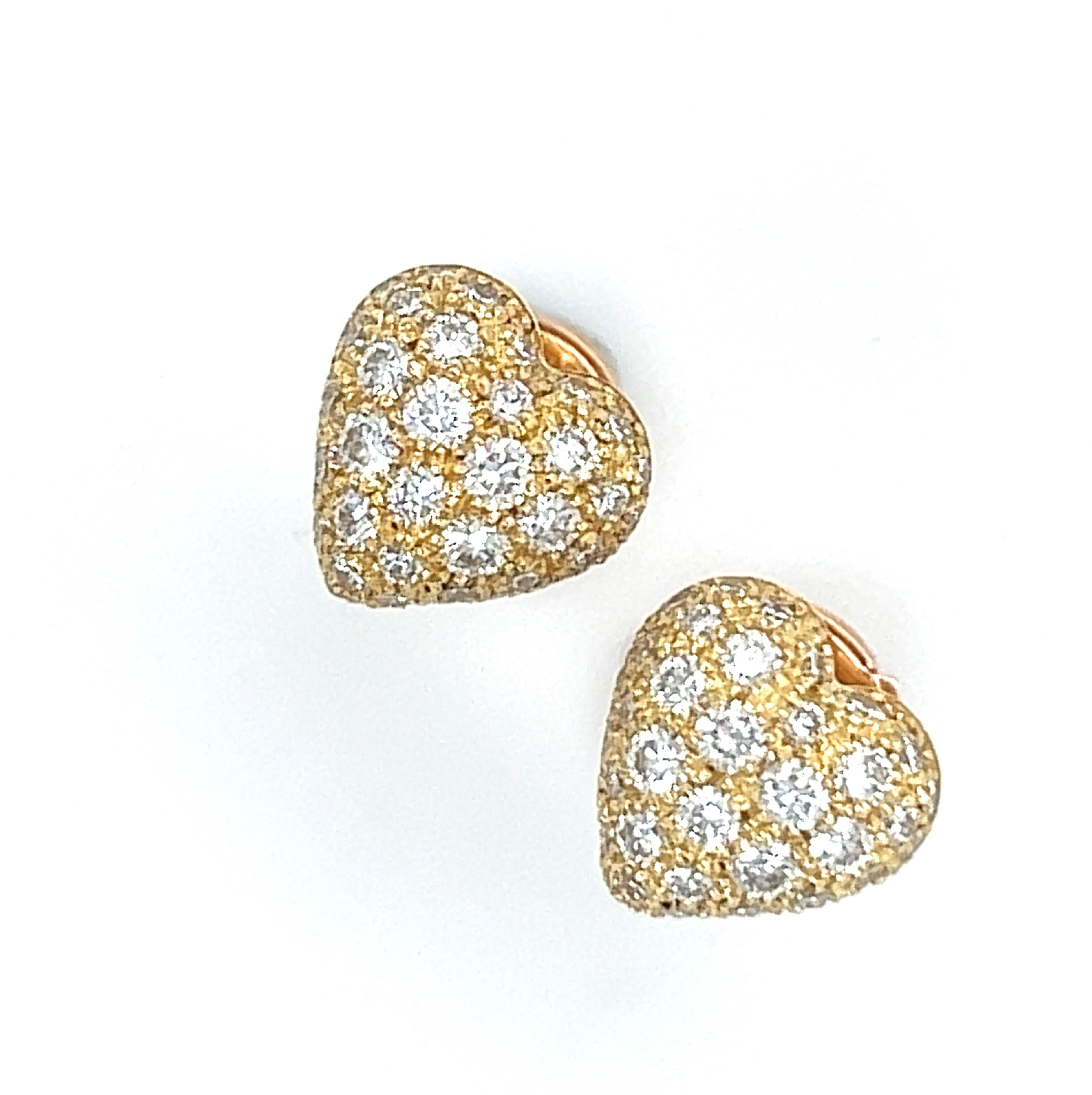 Original 1990, Cartier White Diamond 18Kt Yellow Gold Heart  shaped stud earrings.
A very precious, iconic Cartier top quality circa 1.22KT white diamond heart in a simple, all time wearable 18kt yellow gold setting.
Brimming with utter grace and