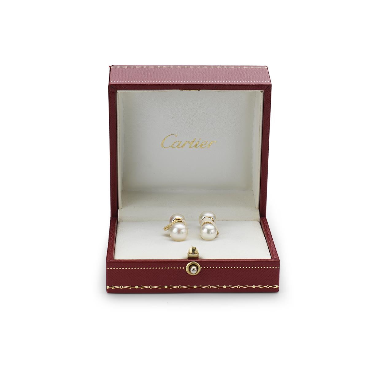 These Cartier cufflinks feature cultured pearls set in 18K yellow gold with Cartier inscription. Cartier box included. 8-9 mm pearls. 

Viewings available in our NYC showroom. 