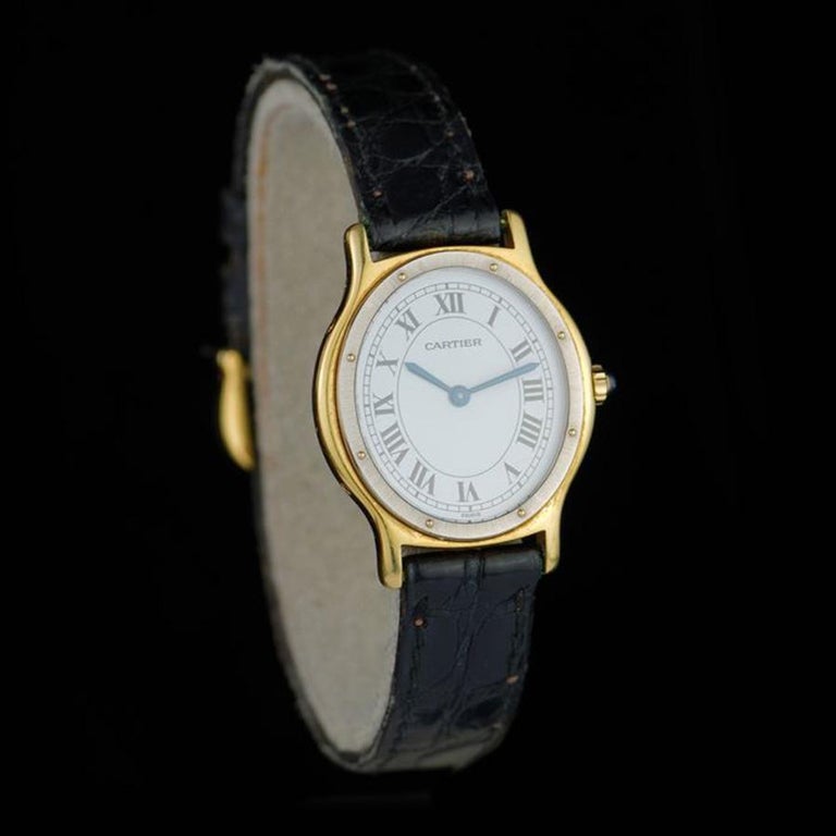 Cartier Ovale Damenarmbanduhr aus 18 Karat Gelbgold und Stahl im