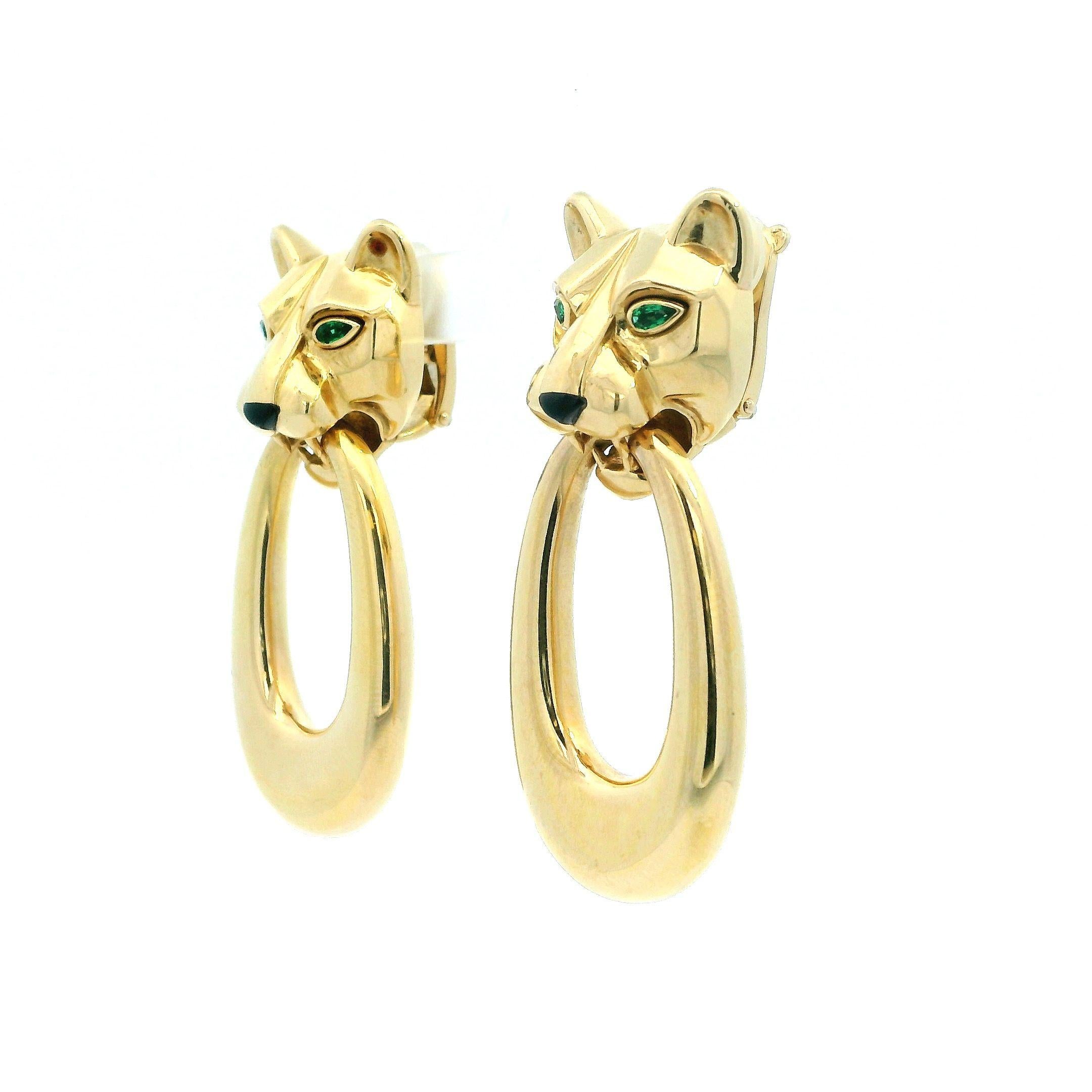 18k Yellow Gold earrings with panther motif and green peridot eyes. Created by Cartier, 1980, France. Day and night earrings with the option of removing the door-knockers. 
Professionally refinish available upon customer's request.

Total weight