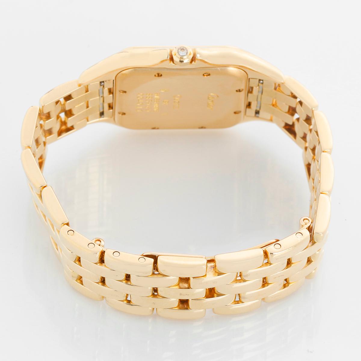 Cartier Panther 18k Yellow Gold Men's Quartz Watch with Date & Diamonds - Quartz. 18k yellow gold case with factory diamond bezel  (27mm x 38mm). Ivory colored dial with black Roman numerals and date at 3 o'clock. 18k yellow gold Cartier Panther