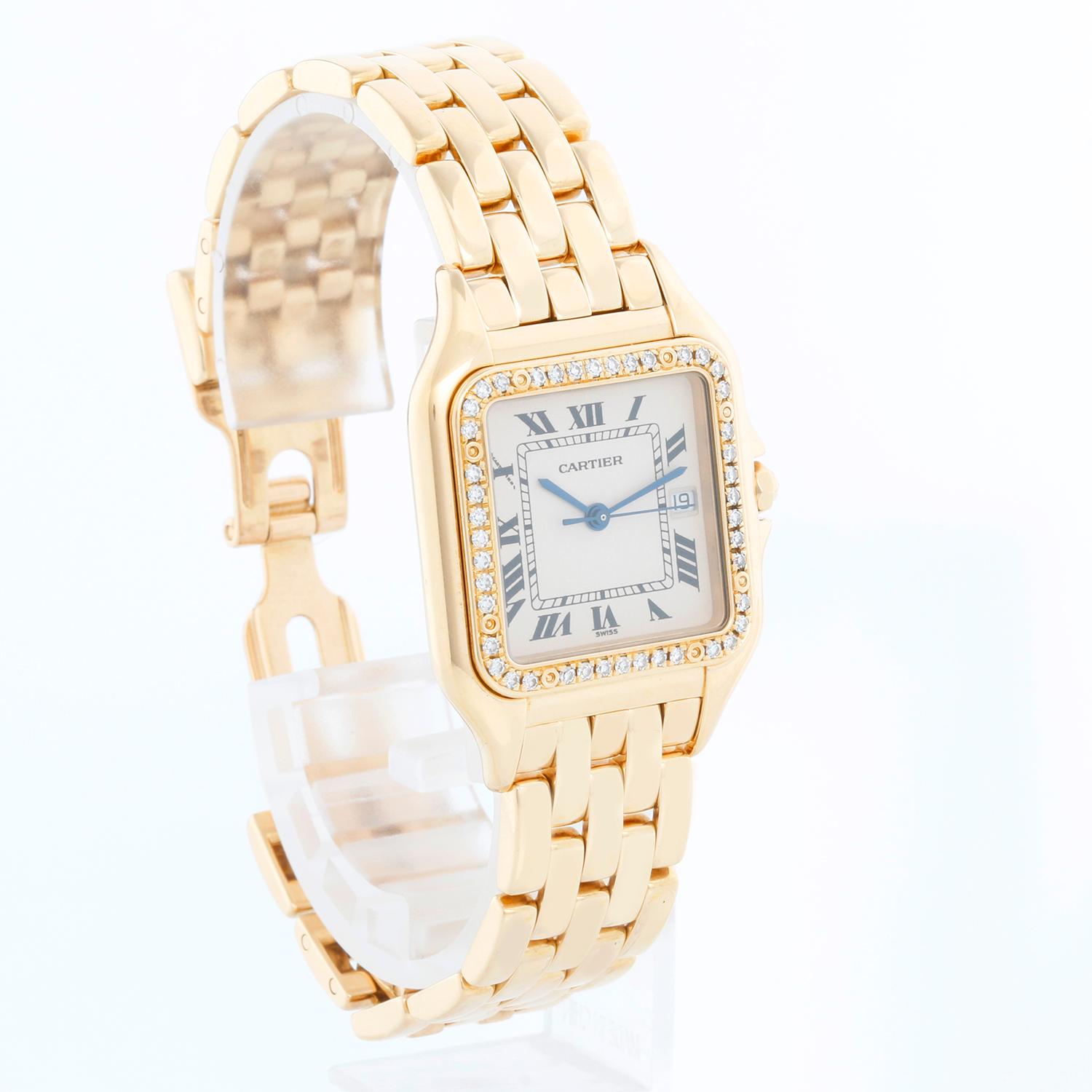 Cartier Panther 18k Yellow Gold Men's Quartz Watch with Date & Diamonds - Quartz. 18k yellow gold case with factory diamond bezel  (27mm x 38mm). Ivory colored dial with black Roman numerals and date at 3 o'clock. 18k yellow gold Cartier Panther