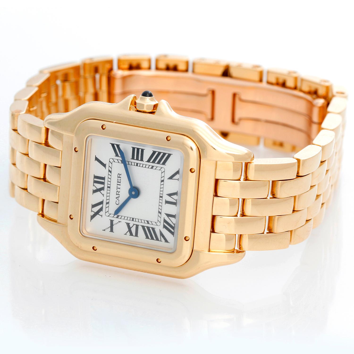 Cartier Panther 18k Yellow Gold Midsize Watch WGPN0009 - Quartz movement. 18k yellow gold case (27 x 37 mm). Silver dial with black Roman numerals. 18k yellow gold Cartier bracelet with deployant clasp. Pre-owned with Cartier box and books. Current