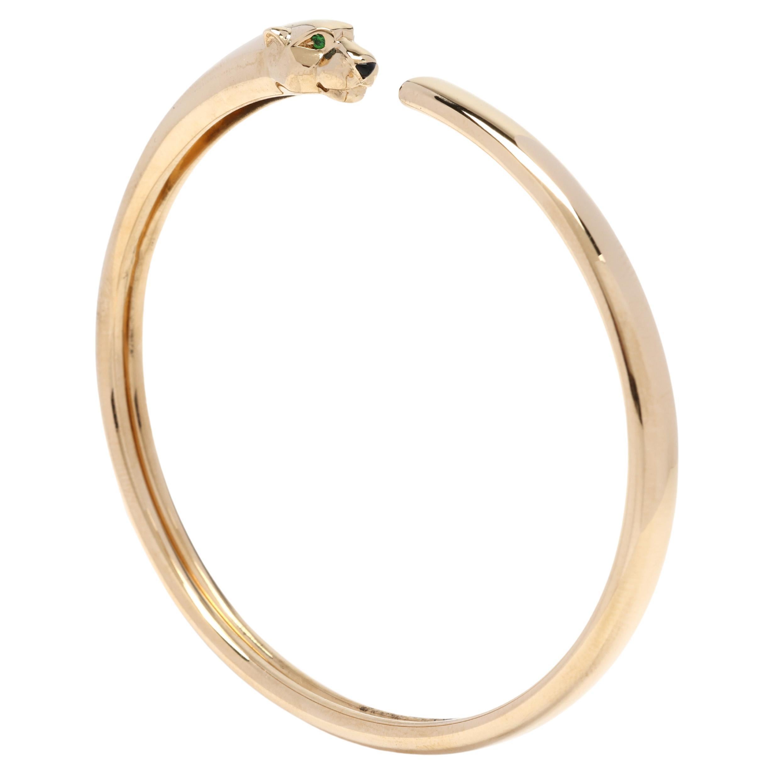 Cartier Pantherarmband, 18 Karat Gelbgold, schwarzer Onyx und Tsavorit Granat