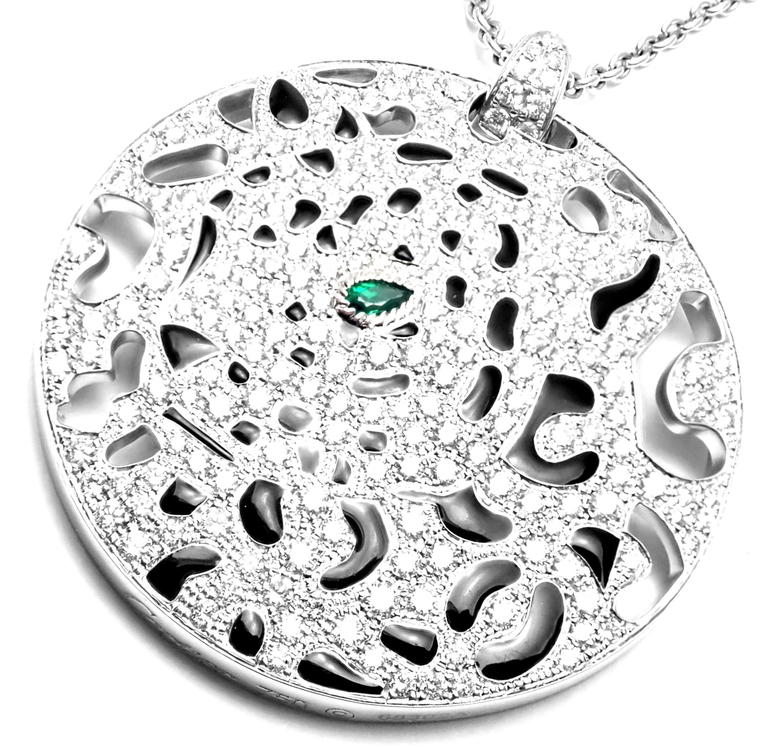 18k White Gold Diamond Emerald Panther Pendant Necklace by Cartier.
With 222 round brilliant cut diamonds VVS1 clarity, E color total weight approx. 3ct and Emerald in the eye.
This necklace is in mint condition and comes with Cartier certificate