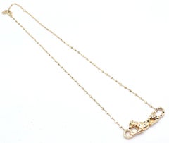 Collar de Cartier con la pantera de diamantes y tsavorita, con cadena de oro amarillo