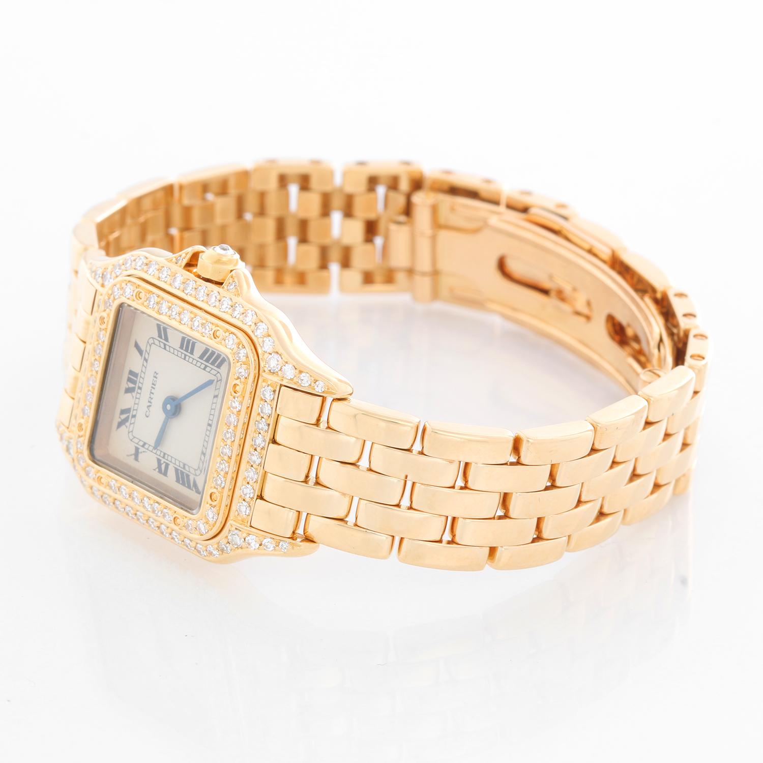 Cartier Panther Ladies 18k Yellow Gold Diamond Watch -  Quartz. 18k yellow gold case with factory diamond bezel (22mm x 30mm). Ivory colored dial with black Roman numerals. 18k yellow gold Panther bracelet. Pre-owned with Cartier box and book.