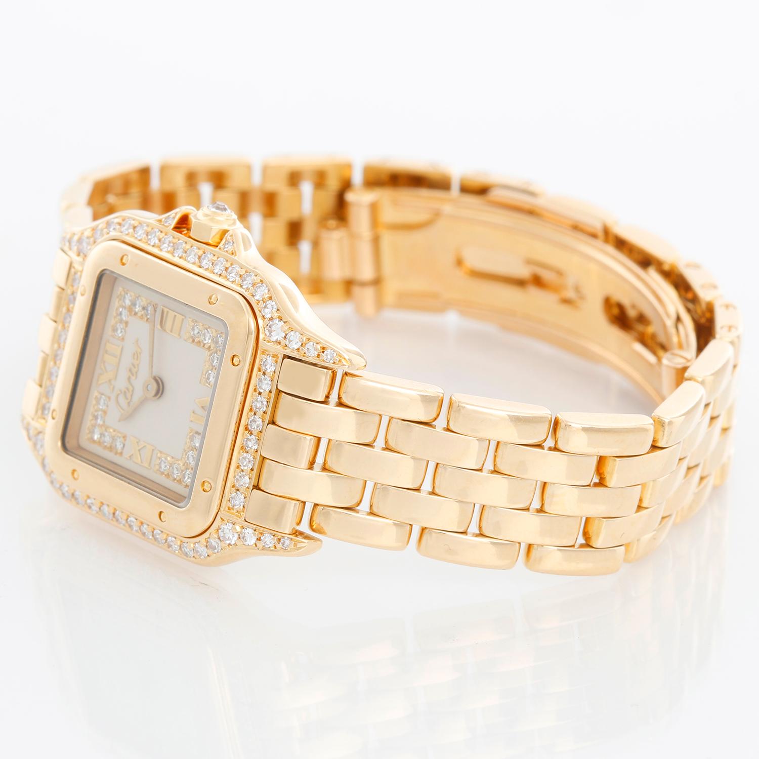 Cartier Panther Ladies 18k Yellow Gold Diamond Watch - Quartz. 18k yellow gold case with factory diamond  lugs (21mm x 30mm). Cream colored dial with raised gold Roman numeral at noon and 6 o'clock. 18k yellow gold Panther bracelet. Pre-owned with