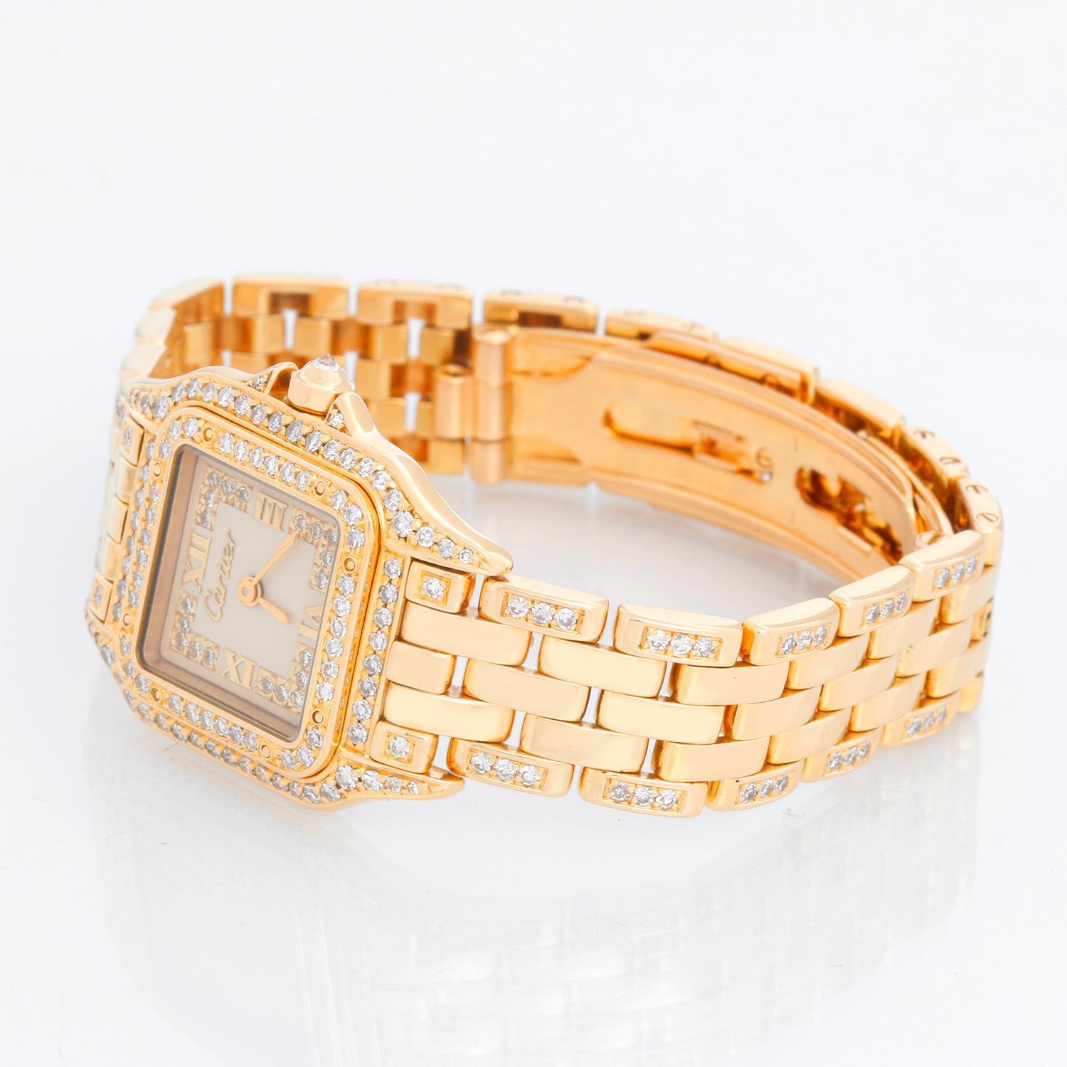 Cartier Panther Ladies 18k Yellow Gold Diamond Watch - Quartz. 18k yellow gold case with factory diamond bezel (21mm x 30mm). Creme colored dial with raised gold Roman numeral at noon and 6 o'clock and pave diamonds. 18k yellow gold Panther bracelet