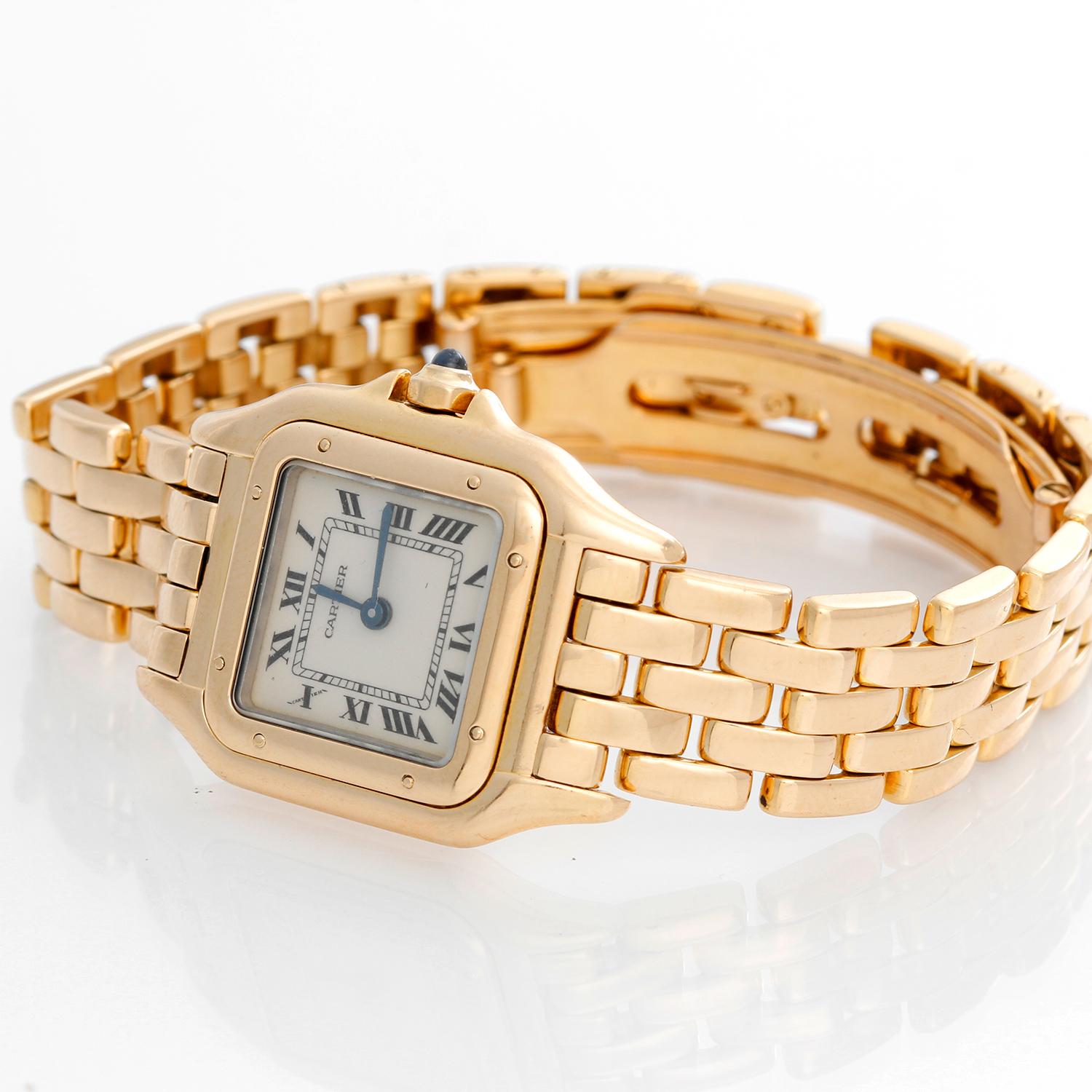 Cartier Panther Ladies 18k Yellow Gold Panthere Watch W25022B9 - Quartz. 18k yellow gold case (21mm x 30mm). Ivory colored dial with black Roman numerals. 18k yellow gold Panther bracelet. Pre-owned with Cartier box and books..