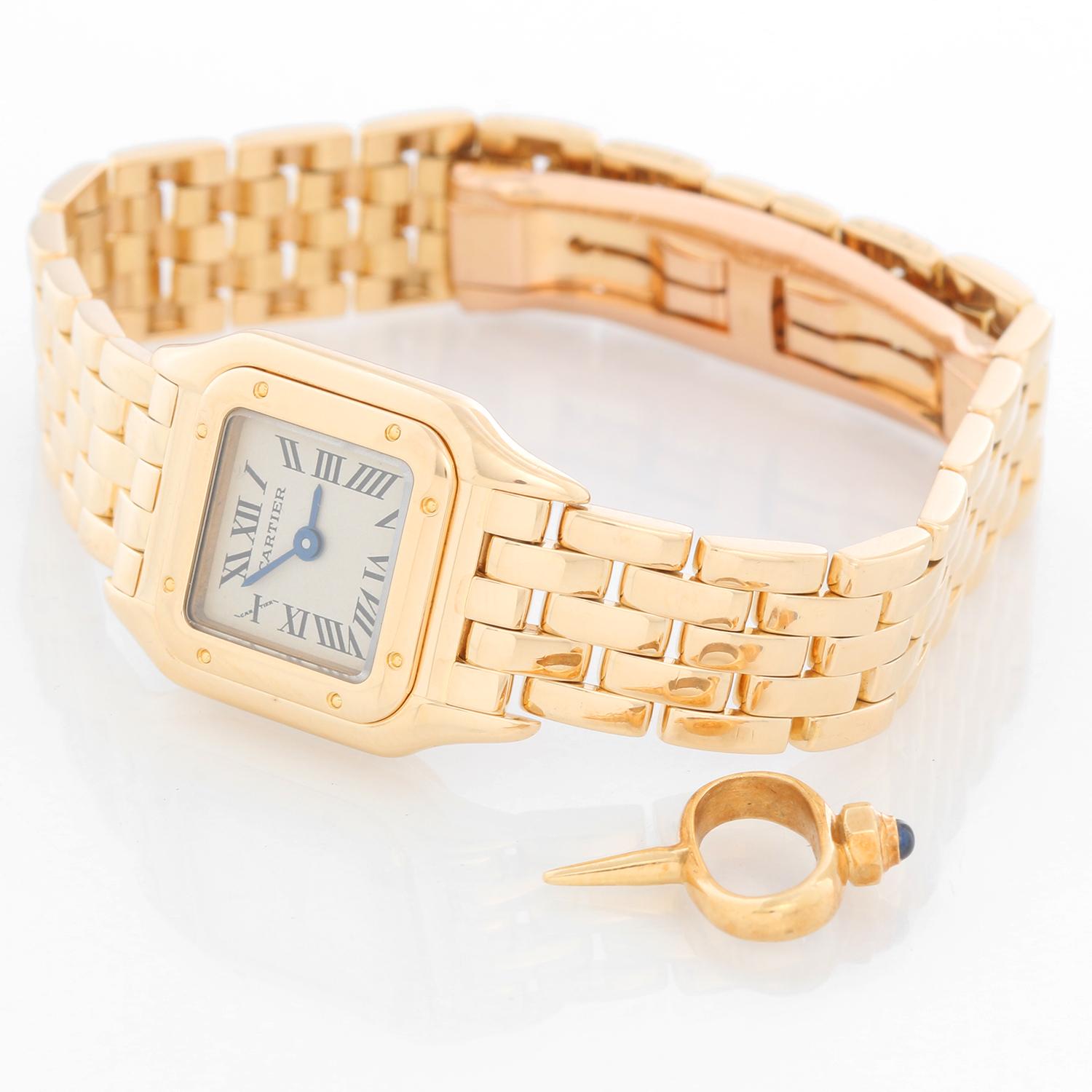 Cartier Panther Ladies 18k Yellow Gold Panthere Watch W25034B9 1130 Mini - Quartz. 18k yellow gold case (17mm x 23mm). Silver colored dial with black Roman numerals. 18k yellow gold Panther bracelet; will fit up to a 5 1/4 inch wrist . Pre-owned