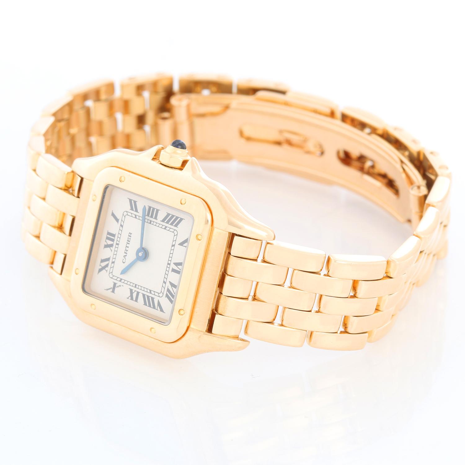 Cartier Panther Ladies 18k Yellow Gold Watch - Quartz. 18k yellow gold case (22mm x 30mm ). Ivory colored dial with black Roman numerals. 18k yellow gold Panther bracelet. Pre-owned with custom box.