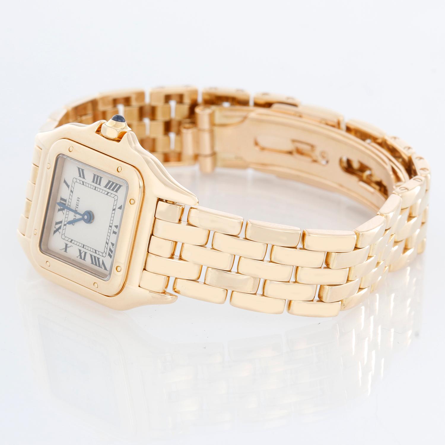 Cartier Panther Ladies 18k Yellow Gold Watch - Quartz. 18k yellow gold case (22mm x 30mm ). Ivory colored dial with black Roman numerals. 18k yellow gold Panther bracelet. Pre-owned with custom box . All watches measure to fit the average size wrist