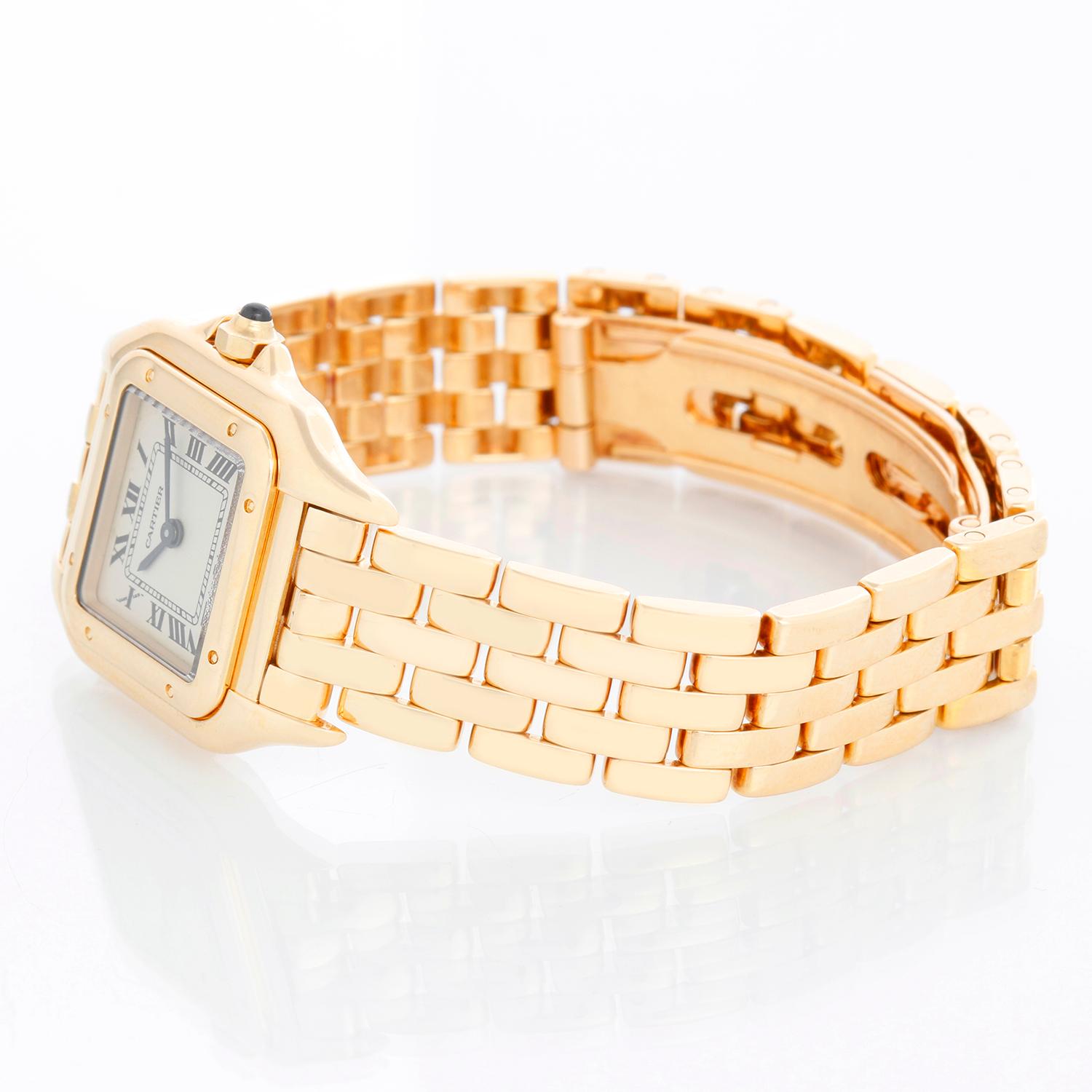 Cartier Panther Ladies 18k Yellow Gold Watch W25022B9 1070 - Quartz. 18k yellow gold case (22mm x 30mm ). Ivory colored dial with black Roman numerals. 18k yellow gold Panther bracelet. Pre-owned with Cartier pouch .
