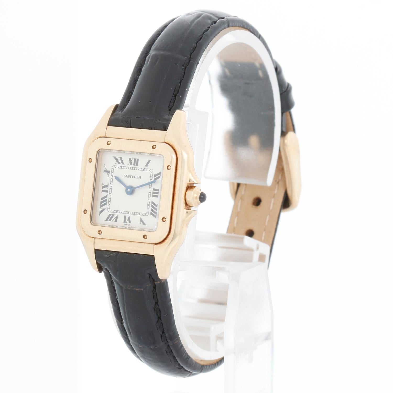 Cartier Panther Ladies 18k Yellow Gold Watch W25022B9 1070 - Quartz. 18k yellow gold case (22mm x 30mm ). Ivory colored dial with black Roman numerals. Black leather strap with buckle. Pre-owned custom box.