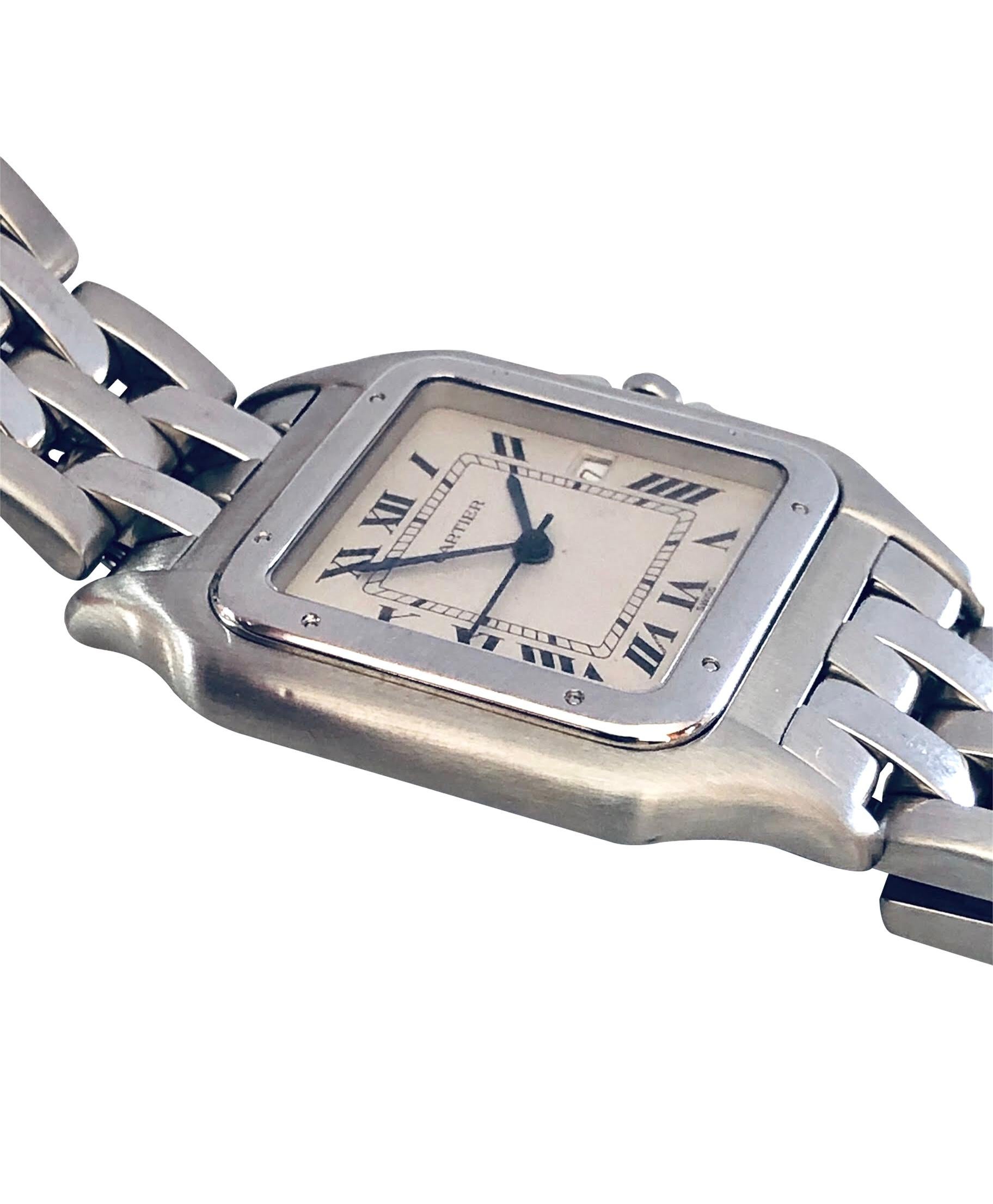 Circa 2000 Cartier Classic Panther Wrist watch, 40 X 30 M.M. Stainless Steel case, Quartz Movement, White Dial with Black Roman Numerals, Calendar window at the 3 position, sweep seconds hand, scratch resistant Sapphire Glass crystal and a sapphire