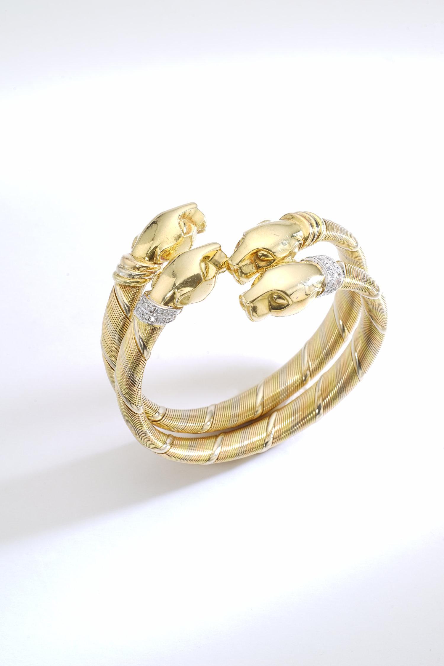 Everyone knows this emblematic Panther design from Cartier.
We are so excited to present a pair wearable on the same wrist. Much better than today's ordinary Love or Juste un clou bracelets this Cartier Paris gold 18k pair of bracelets is your