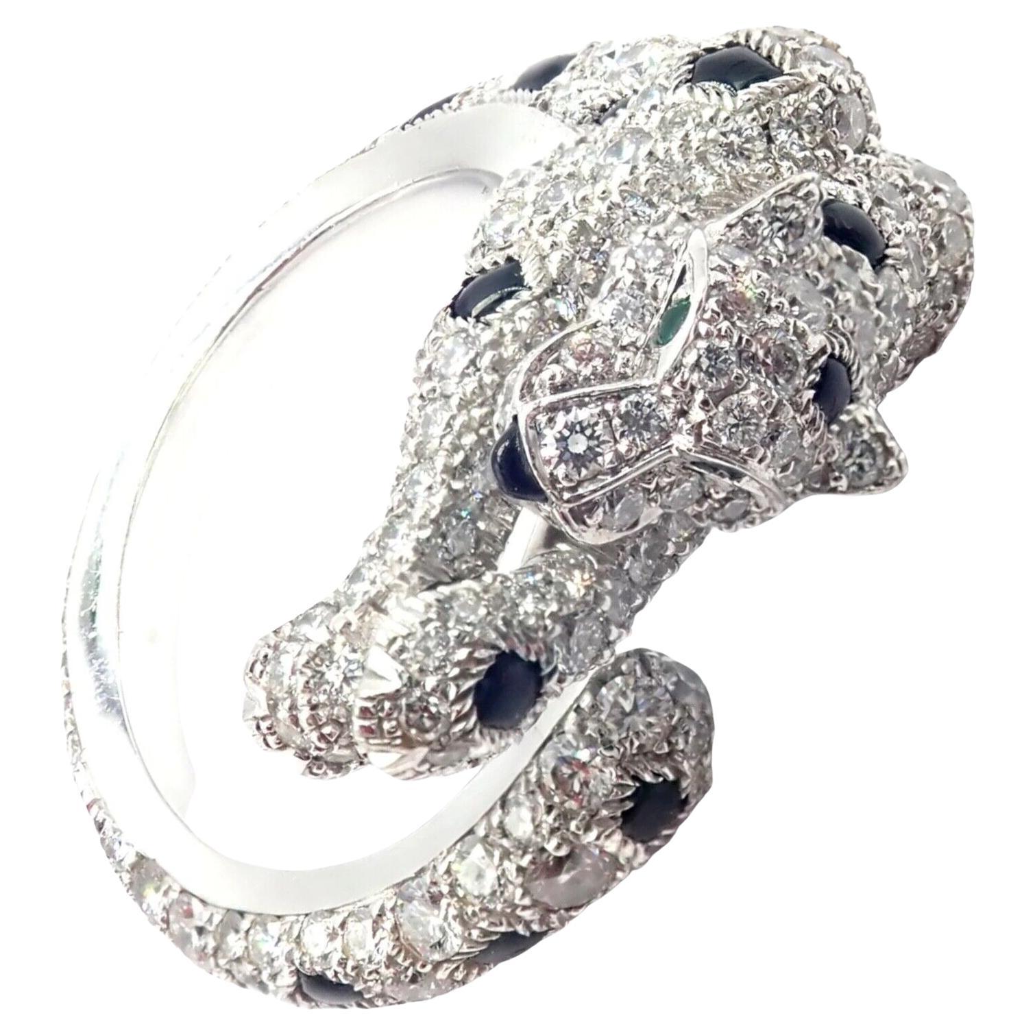 18k White Gold Panther Diamond, Emerald and Onyx Band Ring by Cartier. 
With 264 Round brilliant cut diamonds VS1 clarity, G color total weight approximately 1.66ct 
Black Onyx stones
2 Emeralds in the eyes
The Authentic Cartier Panther Panthere