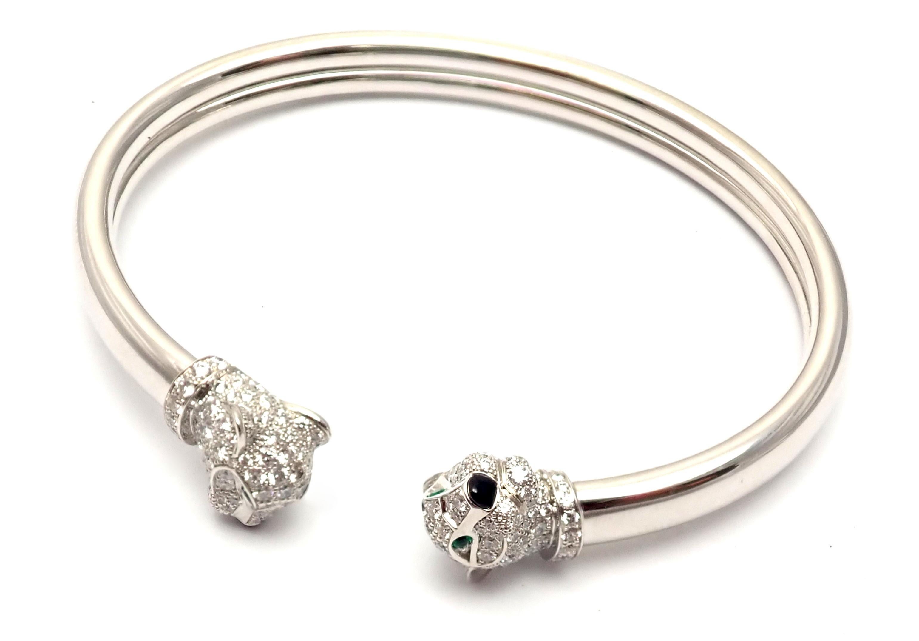 18k White Gold Diamond Onyx Emerald Panther Panthere Bangle Bracelet by Cartier. 
With 194 round brilliant cut diamonds VVS1 clarity, E color total weight approx. 1.37ct
4 emeralds, 2 onyx
This beautiful bracelet comes with its original Cartier box