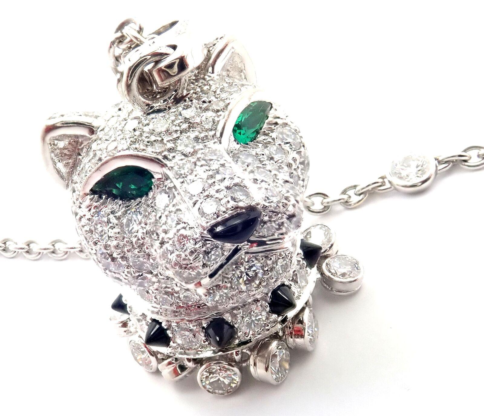 18k White Gold Diamond Emerald Onyx Panther Panthere Pendant Necklace by Cartier.
With Pendant Round brilliant cut diamonds VVS1 clarity E color total weight approximately 5ct
2 emeralds in the eyes
1 onyx nose
Chain 12 round brilliant cut diamonds
