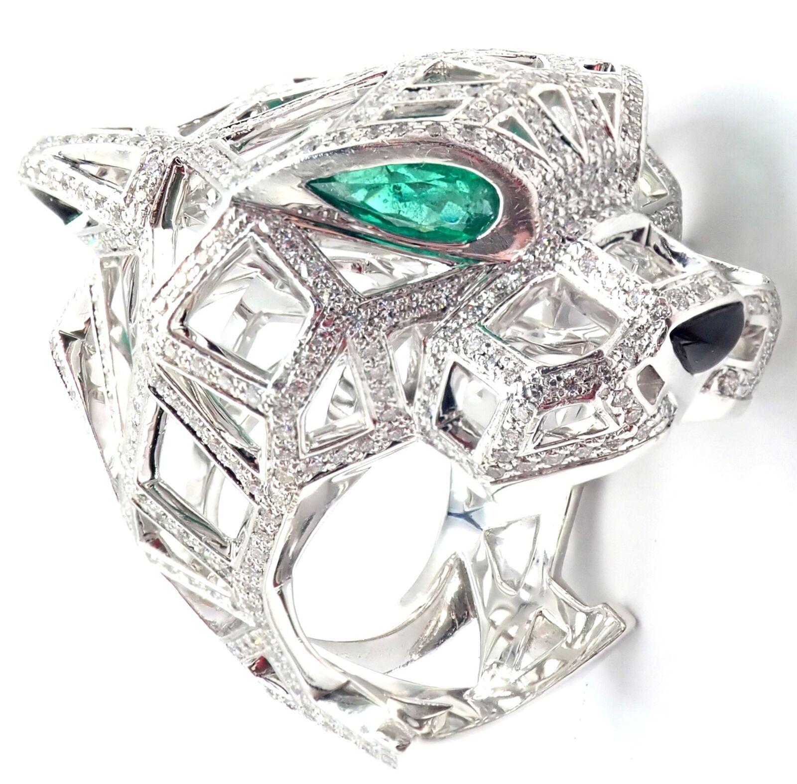 18k White Gold Panther Panthere Emerald Diamond Onyx Paved Large Ring by Cartier. 
With 545 brilliant cut diamonds VS1 clarity, E color total weight approximately 1.47ct
2 emeralds in the eyes 1 onyx nose
This ring comes with service paper from